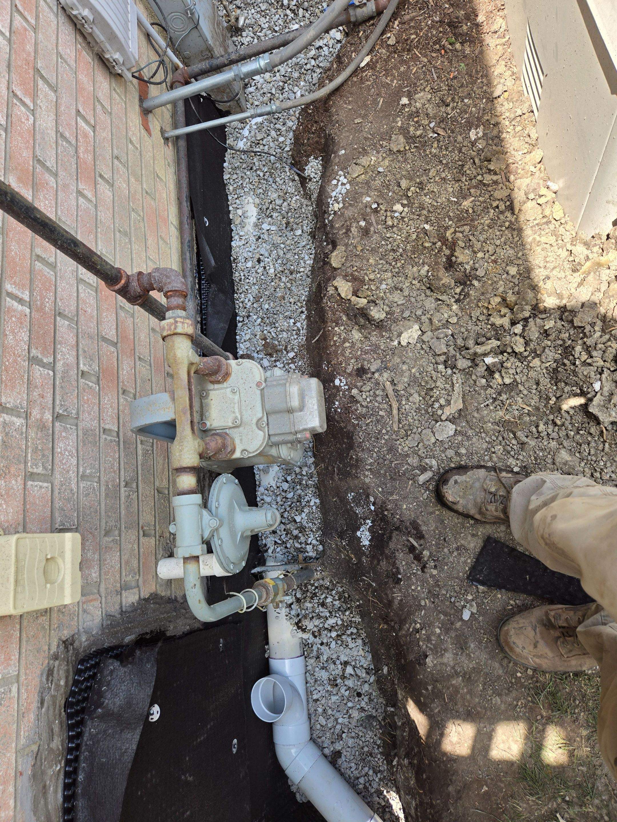 Burial of Sump Pump and Down Spout Discharges and Partial Waterproofing of Wall by Allied Water Services