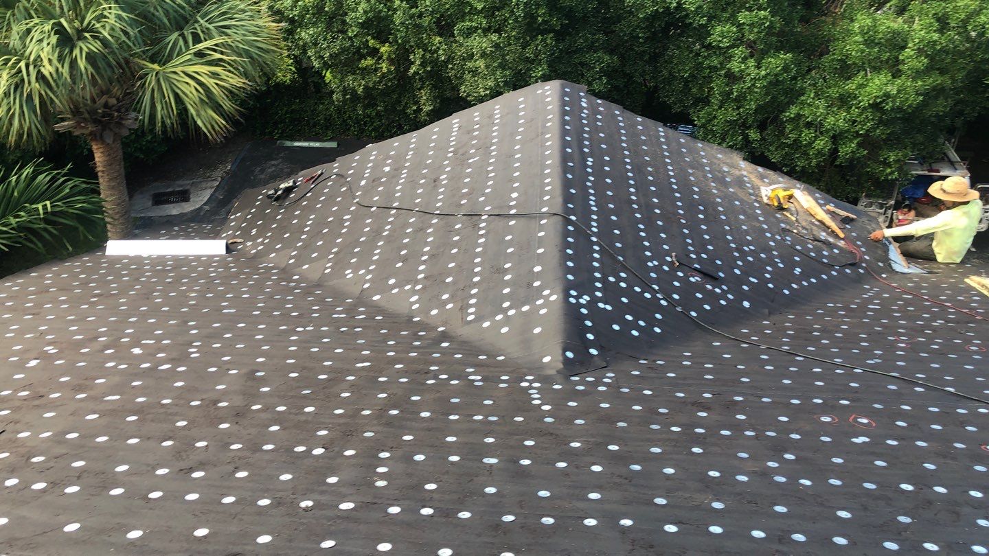 Commercial Roofing Installation using 1" Nail strip metal roof by BLUES BROTHERS ROOFING