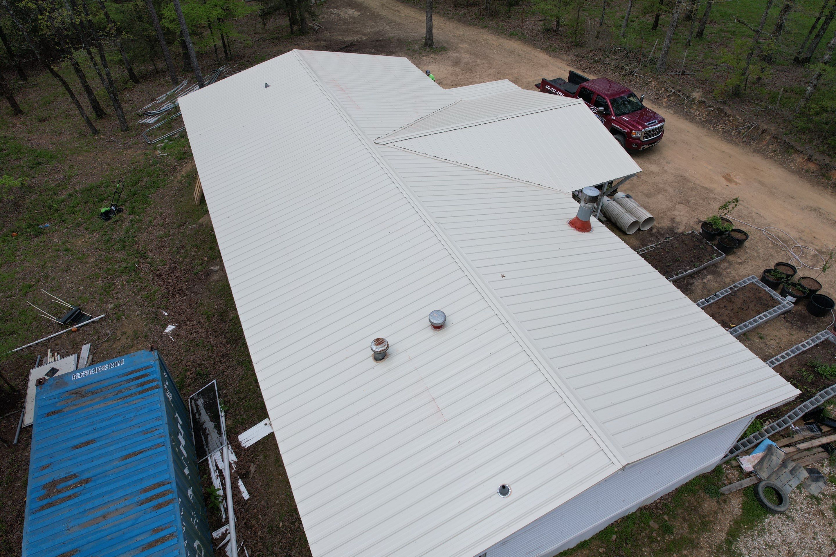 Residential Roofing Installation using 26 Gauge Colored Panels by Hostetler Roofing