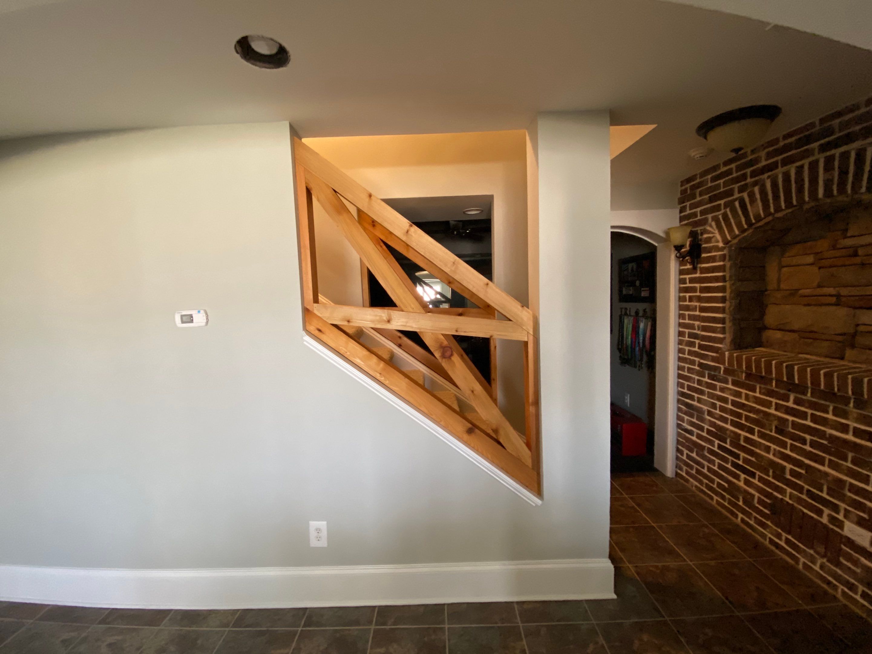 Finished Basement Renovation with Custom Shiplap and Modernized Wood Railings by Swift Home Renovations 