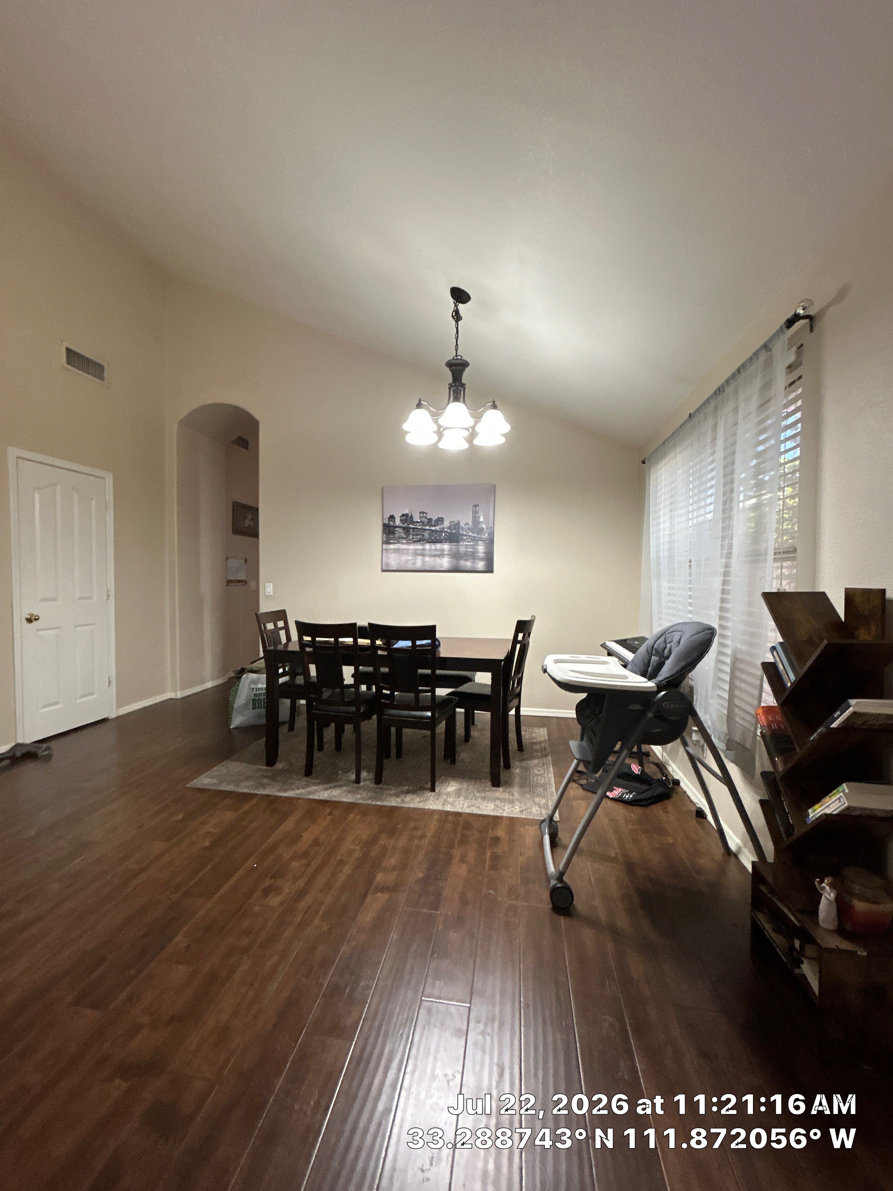 Chandler Dining Room Floor Remodel with Dark Wood-Look Laminate by CompanyCam Sales Demo