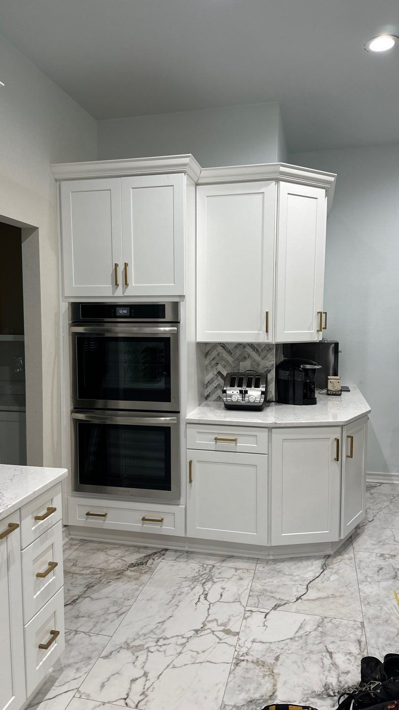Luxury White Kitchen Remodel in The Dominion Featuring Custom Cabinetry and Marble Finishes by Legacy Bath and Kitchen