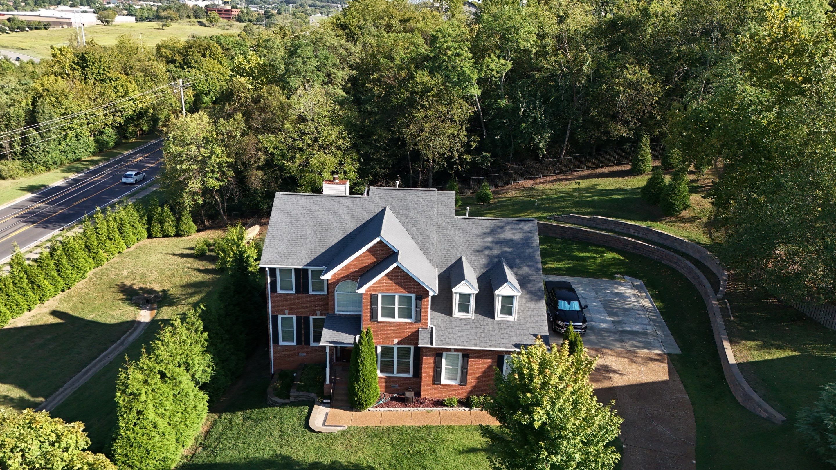 Charcoal Black Re-Roof & Gutters by Royal House LLC