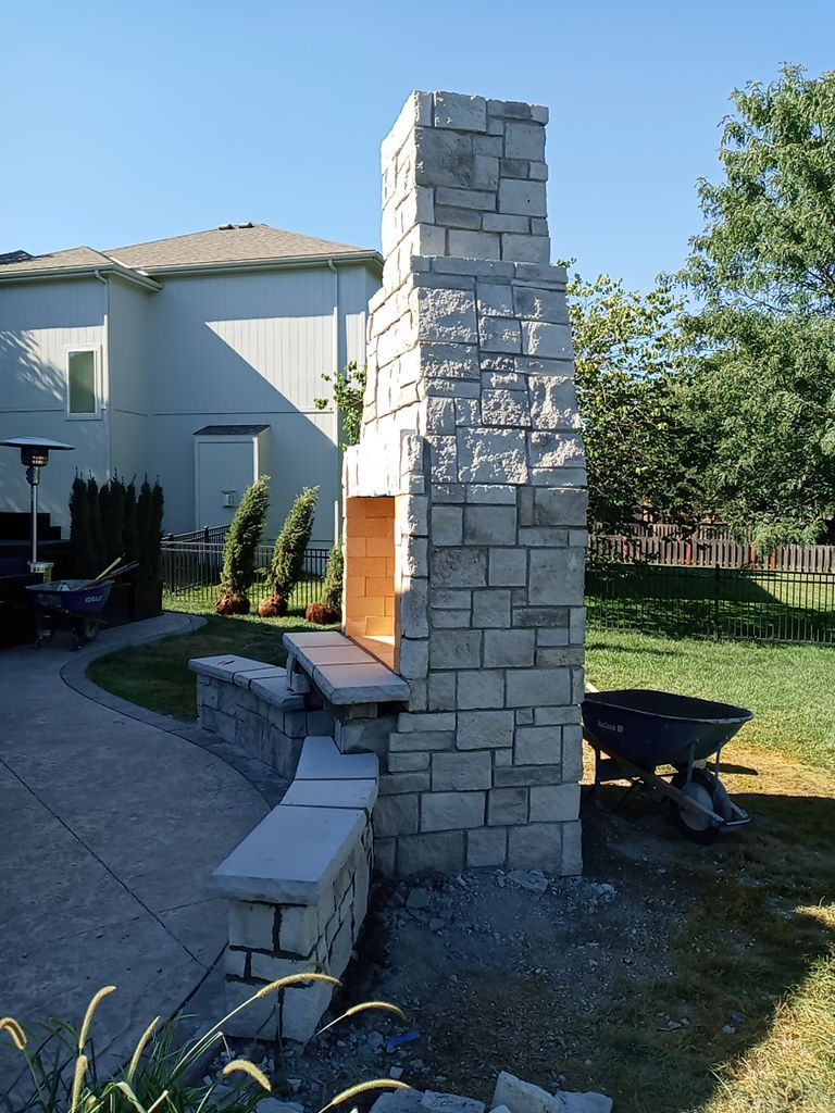 Back Yard Fireplace and Landscape by LAND ESCAPES LLC