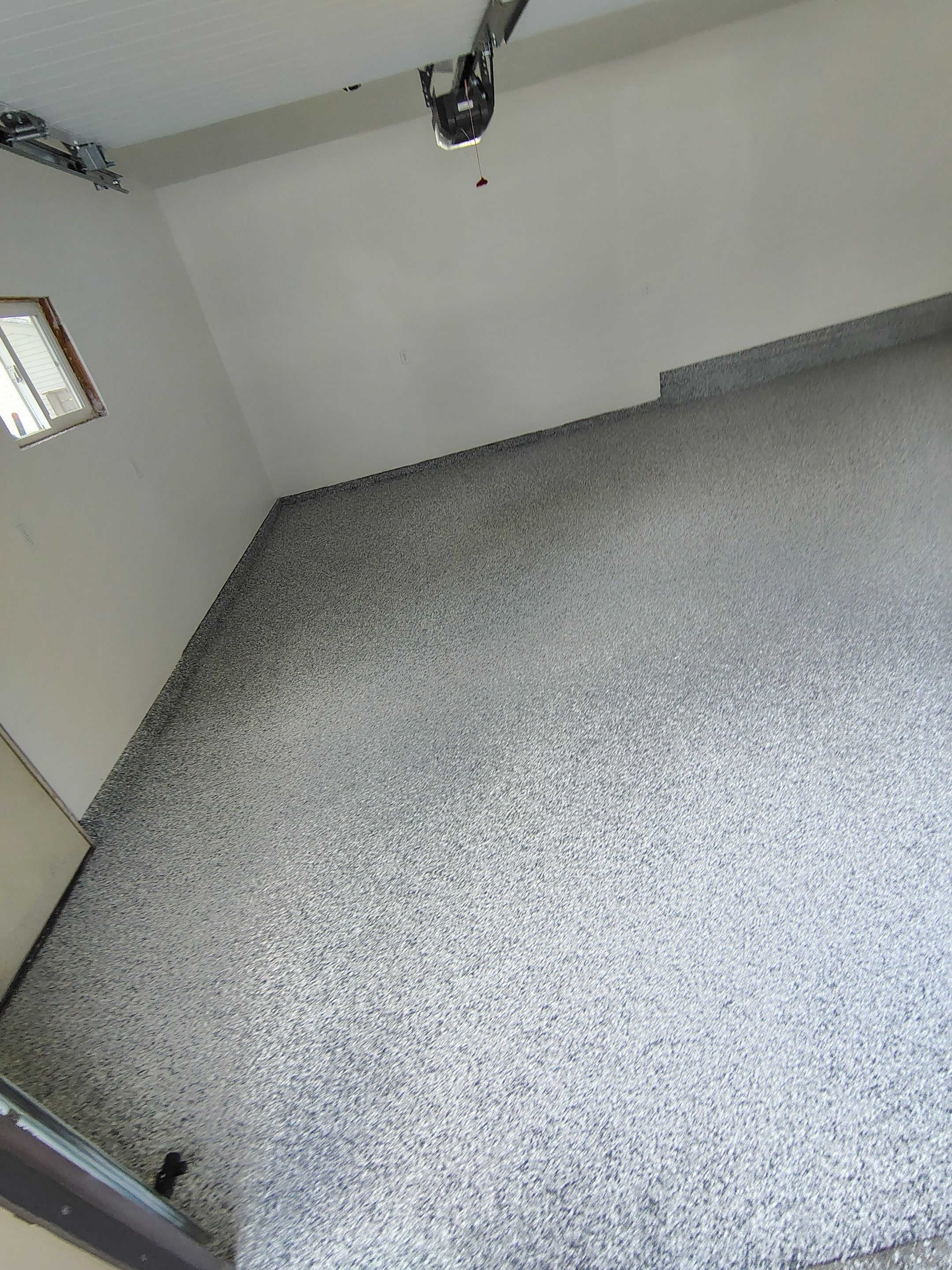 Epoxy Concrete Coating and Garage Floor Restoration in Sioux Falls by Select Painting, Coatings & Garage Cabinets