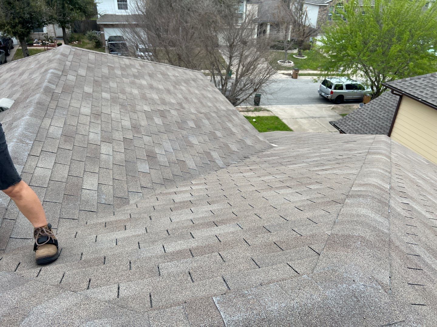 Wind damaged roof replacement by Oakwood Roofing and Construction, LLC