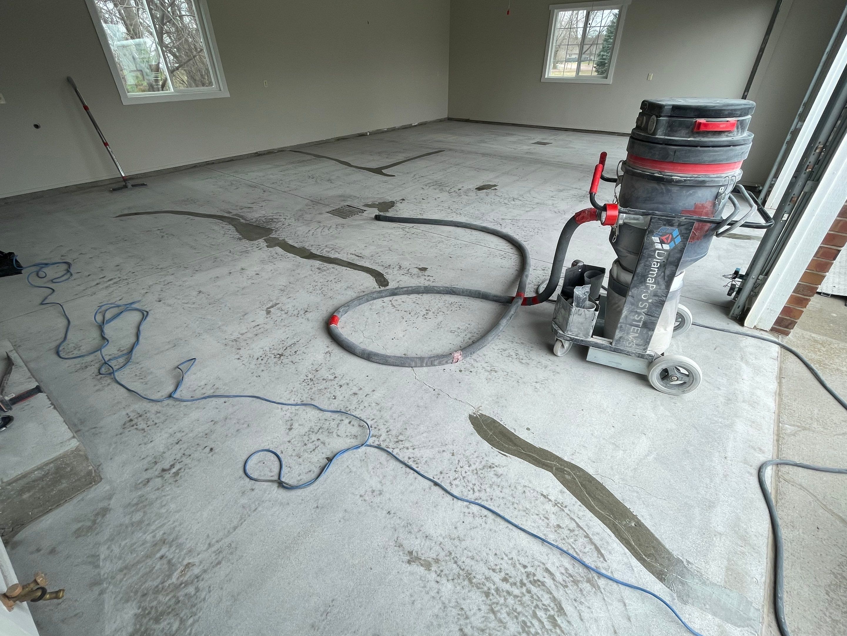 Garage transformation in Yankton by Select Painting, Coatings & Garage Cabinets