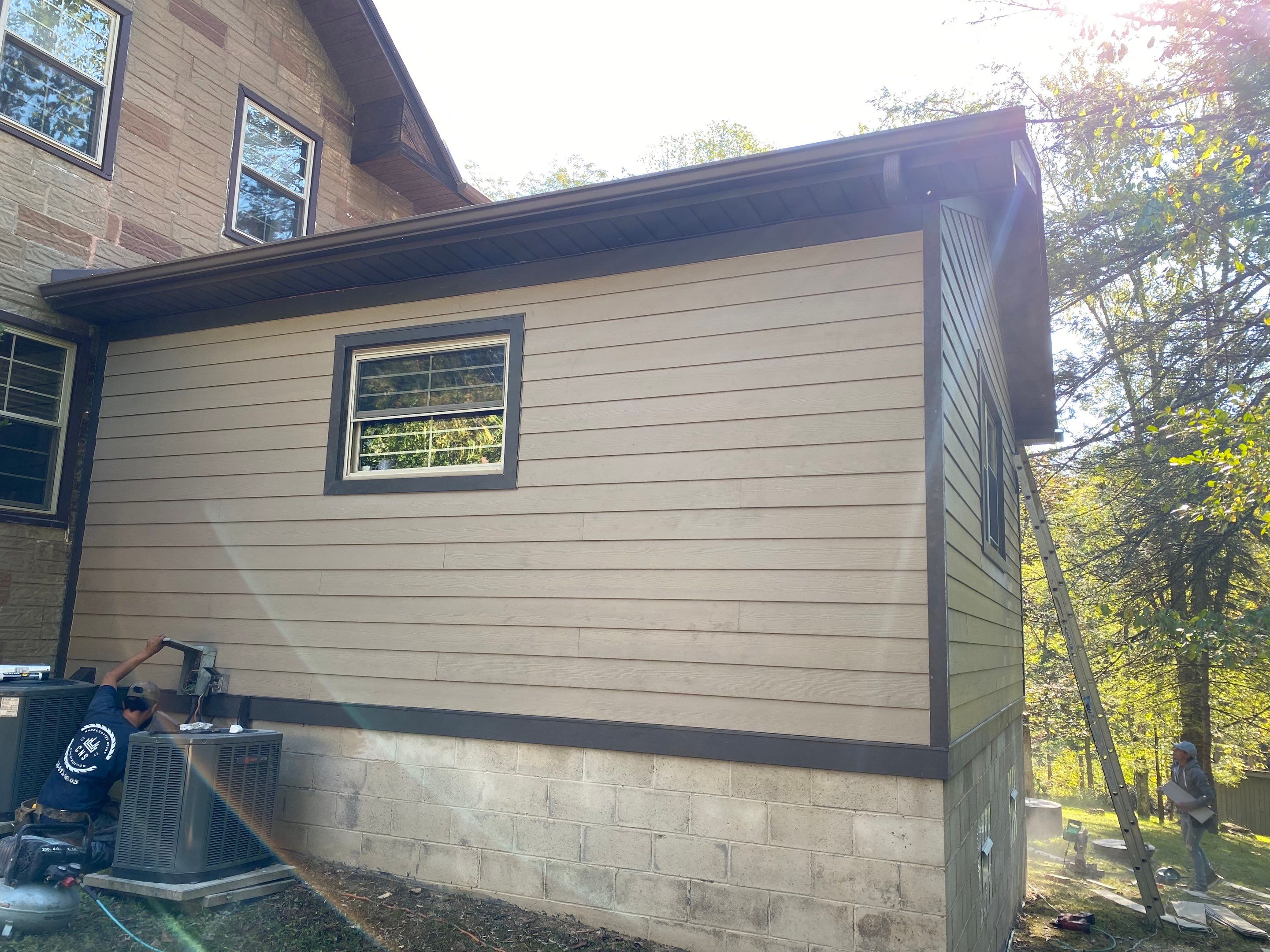 Hardie siding project  by Cousins Roofing Siding & Decks