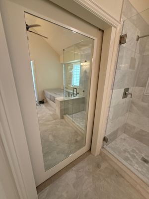 Frameless Shower and Mirror for Closet Applied to Pocket Door 