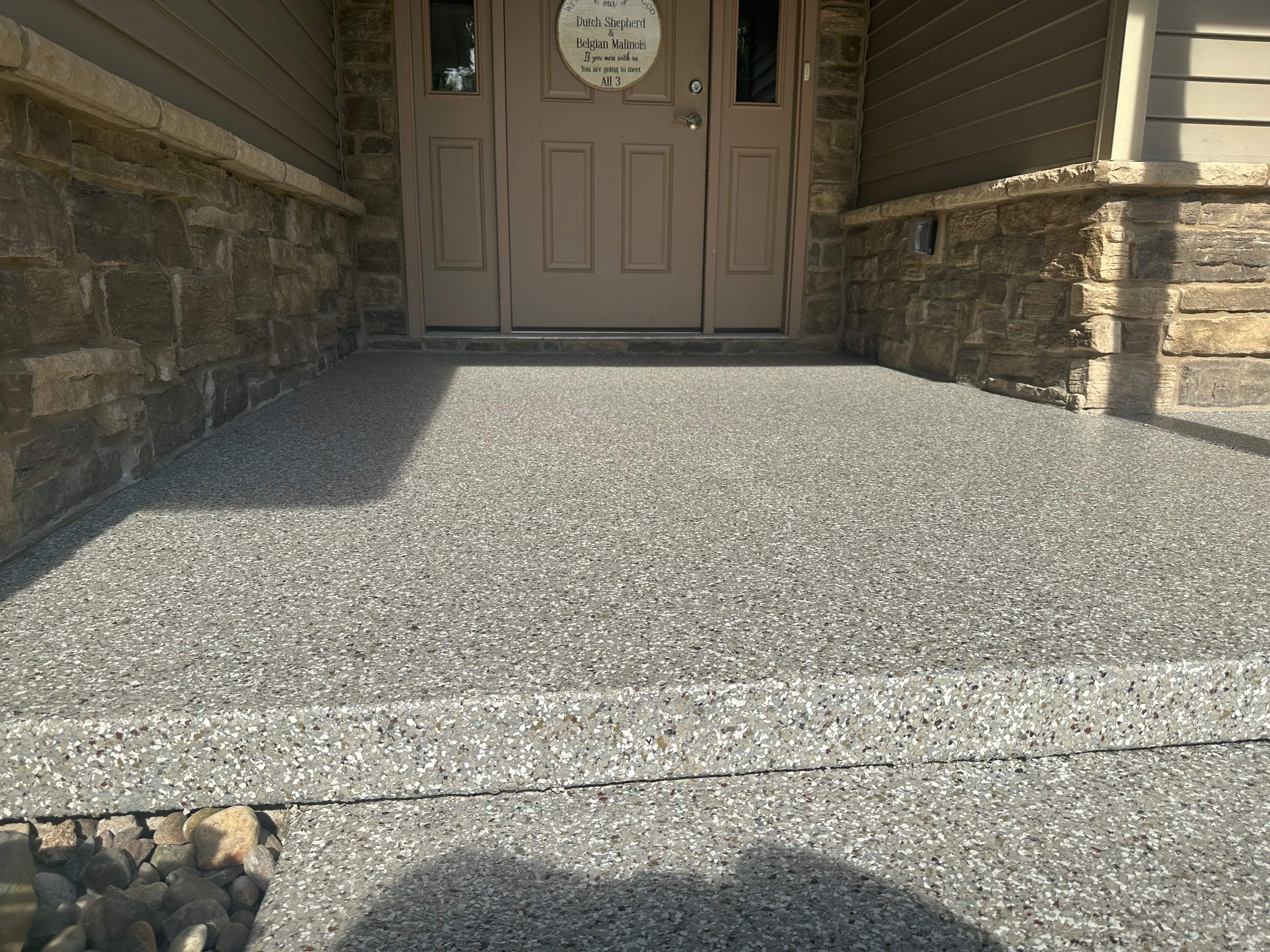 Creekbed Back Patio  by Level 10 Coatings
