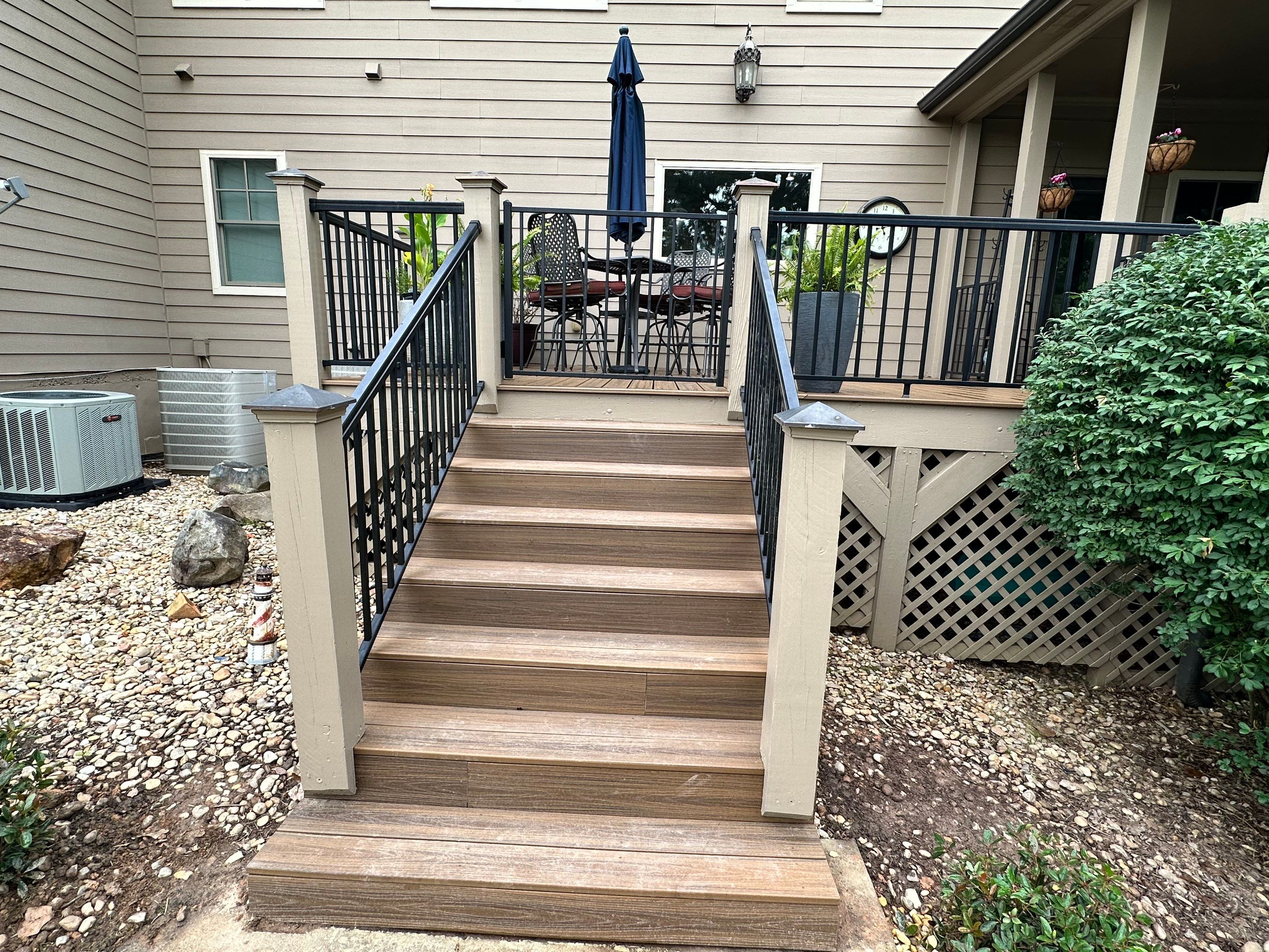 Composite Deck Flooring and Black Metal Railing Replacement in Dallas by Swift Home Renovations