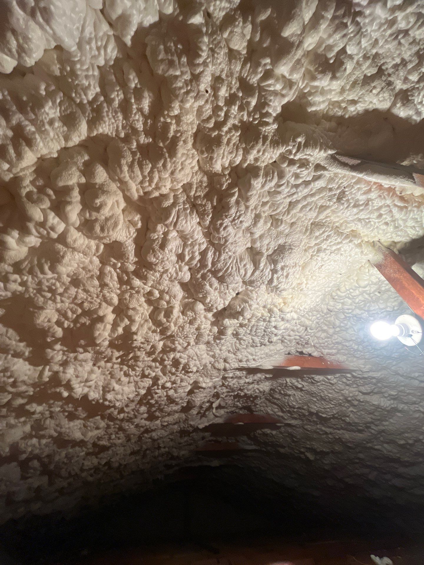 Garage ceiling using open cell spray foam by NYS Foam & Energy