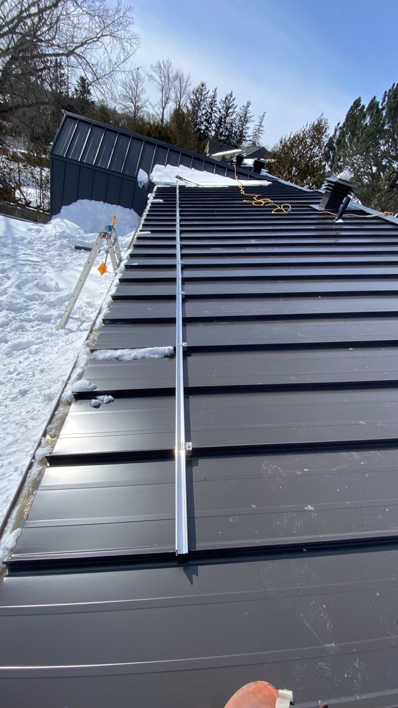 Residential Roofing Installation using 16" Standing Seam Panels by Jay Carter Roofing & Sheet Metal