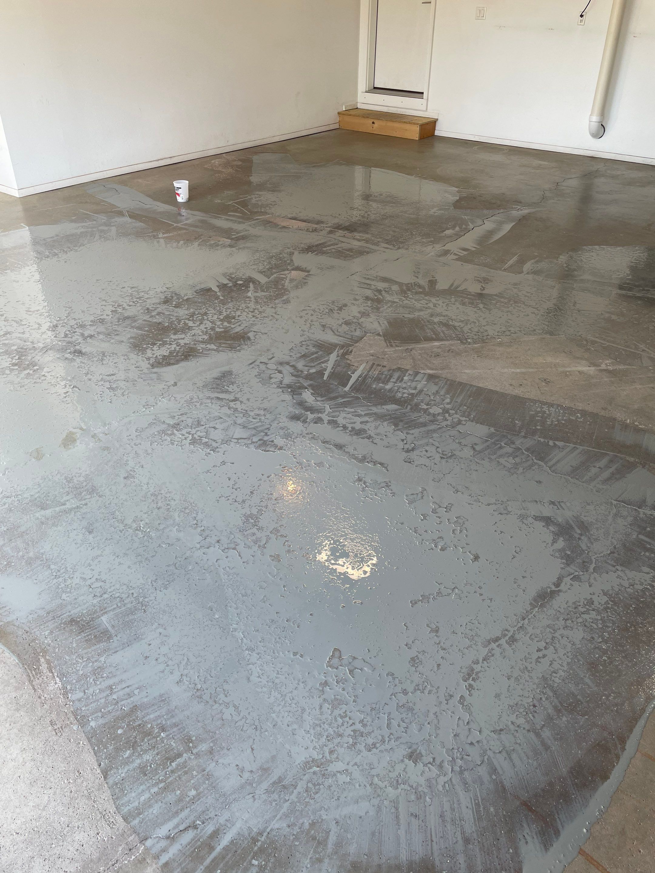 Yankton Garage Floor Restoration with Gray Speckled Epoxy Coating by Select Painting, Coatings & Garage Cabinets