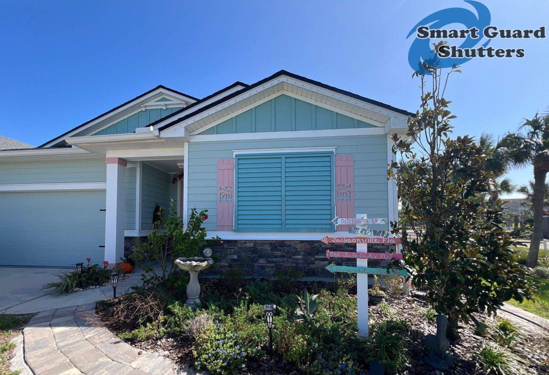 Impact Bahama Shutters in Pastel Turquoise by Smart Guard Shutters