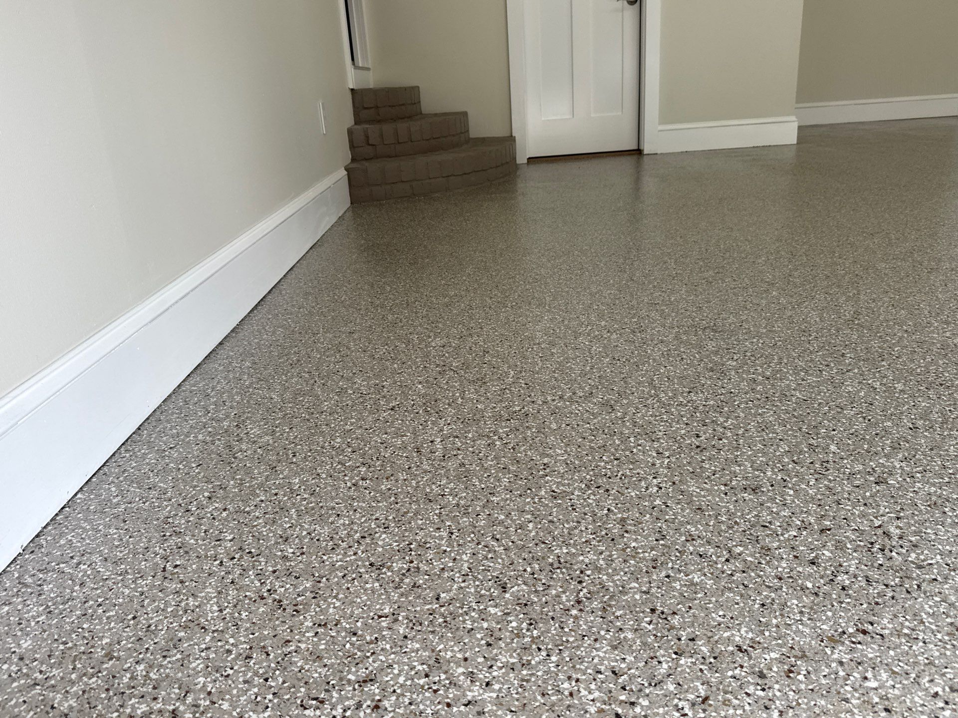 Garage and Sidewalk Project in Keystone Heights, FL in Pebble Beach by Cross Creek Concrete Coatings