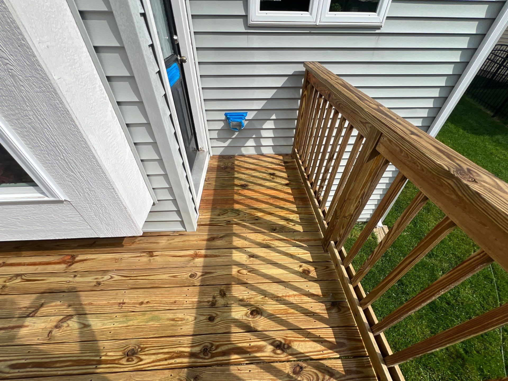 wood deck cleaning and staining by Northern Power Washing LLC.