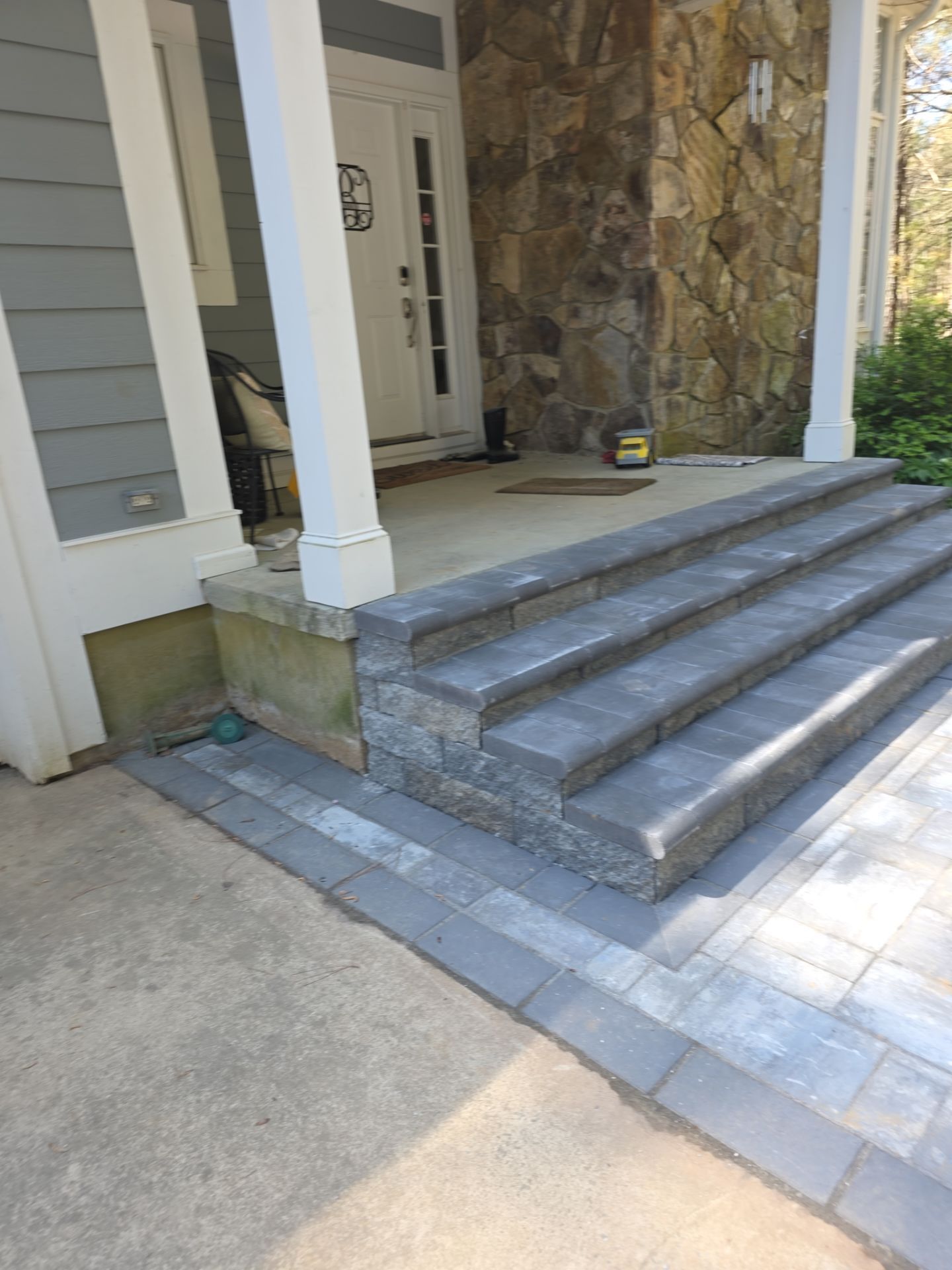 Pittsboro Outdoor Living Transformation – Retaining Wall, Paver Patio & Elevated Deck by Elite Remodeling and Design LLC