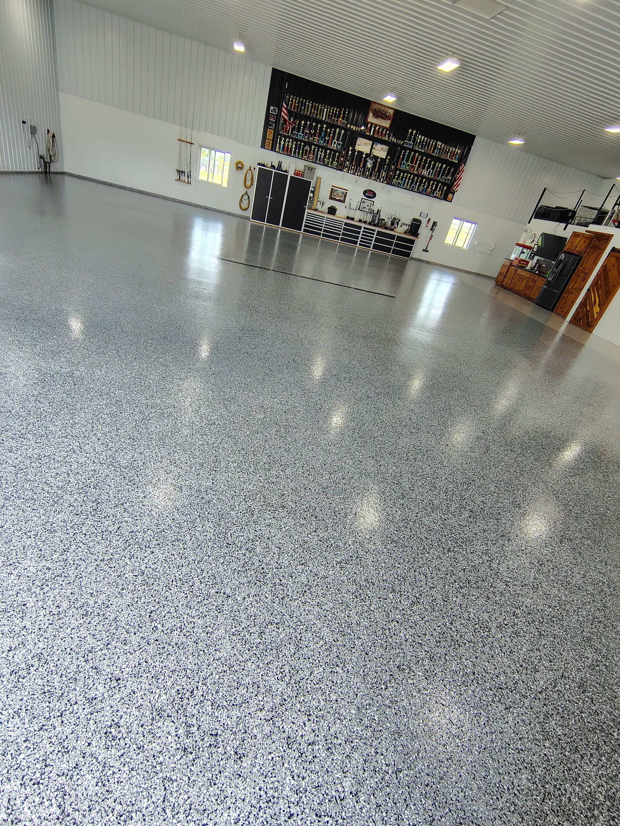 Multi-Stage Concrete Floor Coating for Egan Shop and RV Storage by Select Painting, Coatings & Garage Cabinets