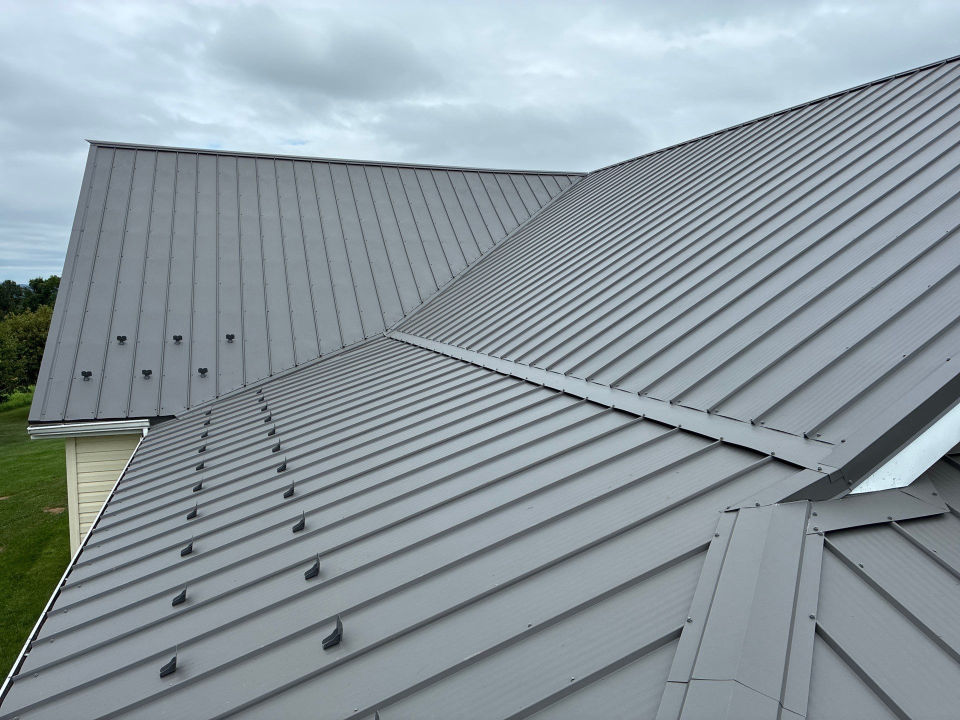 Newport Metal Roof Replacement with New Skylights by Esh Builders