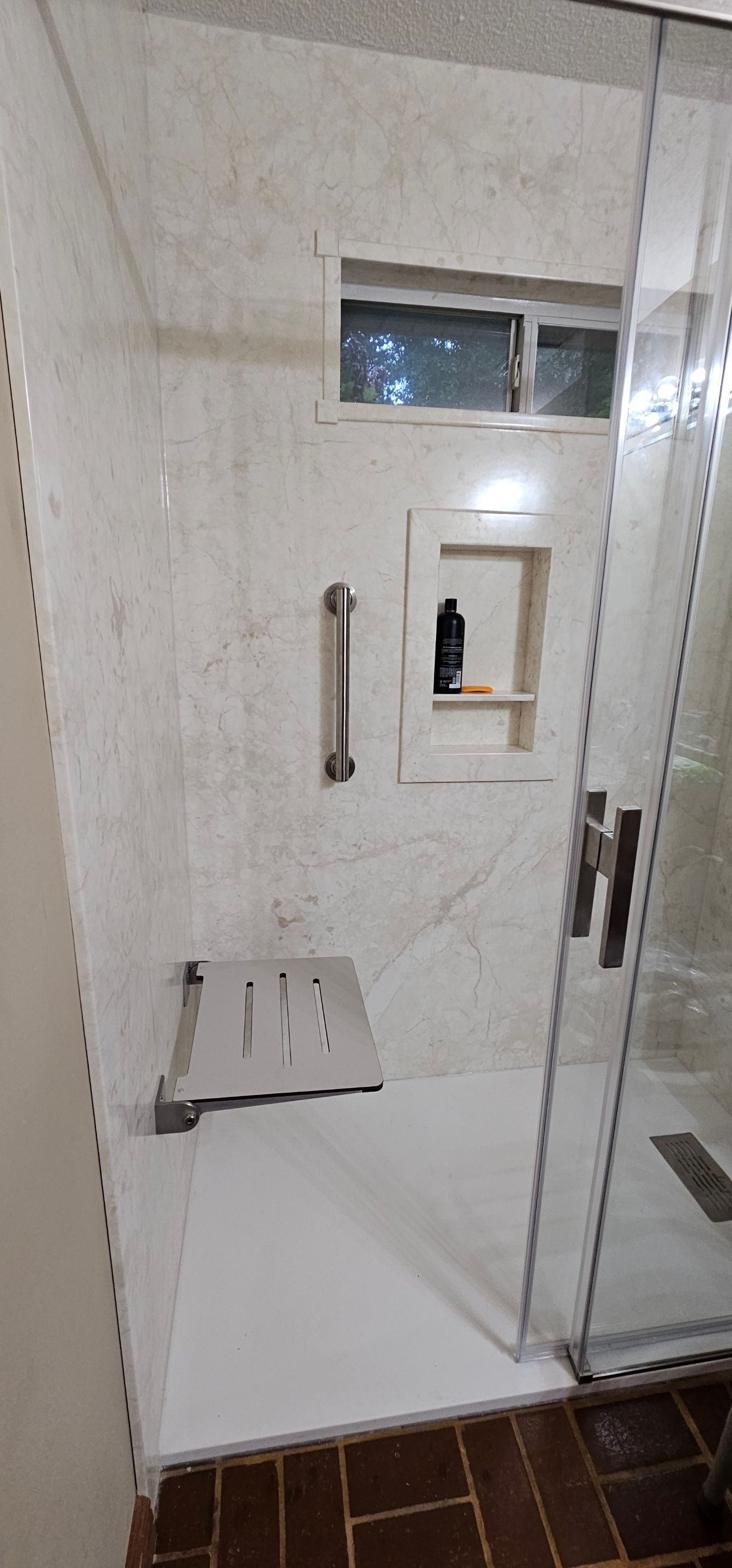 Sentrel Shower with window and ADA chair / ADA grab bar by Academy Construction