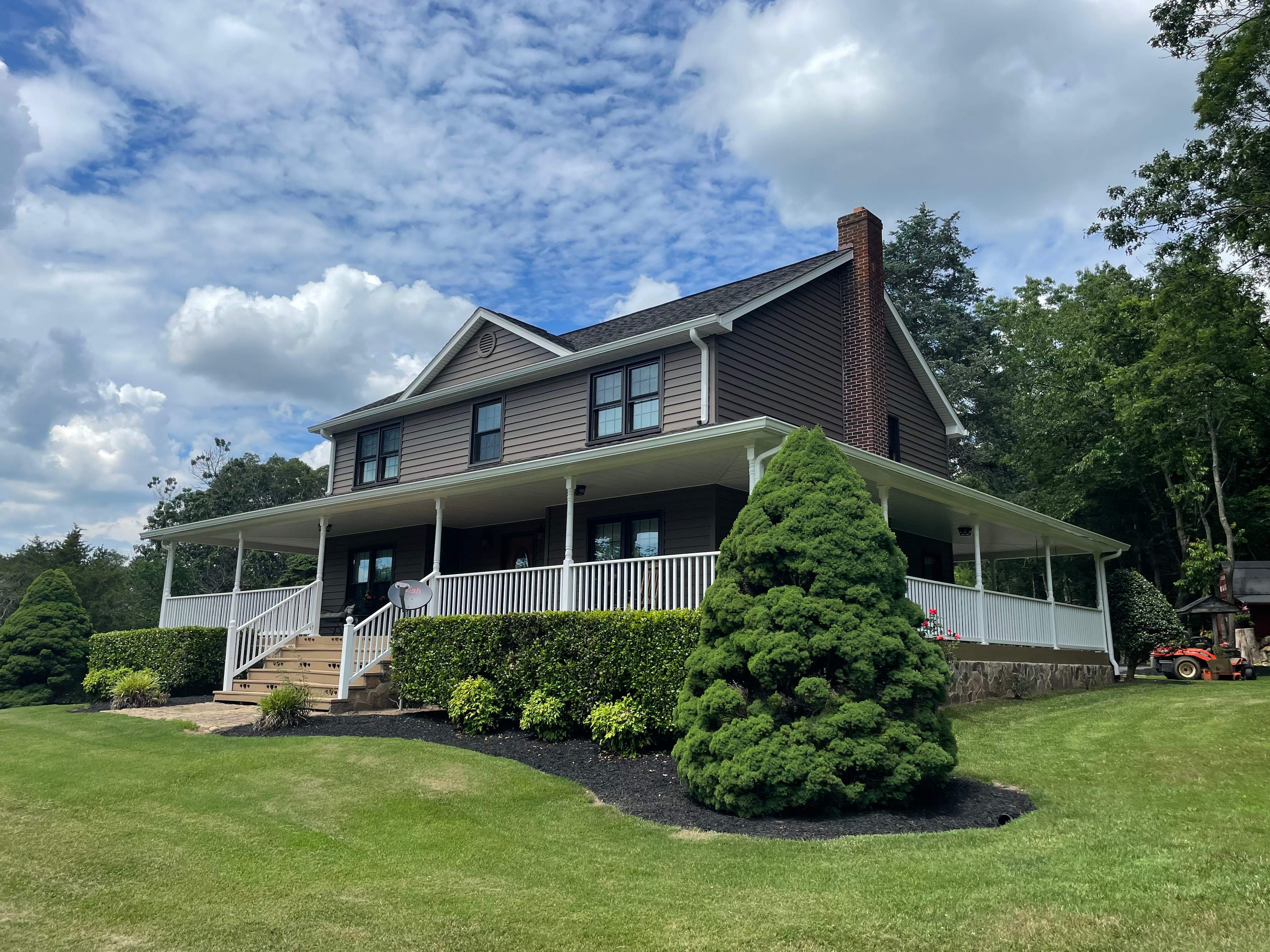 Exterior remodel including window replacement by American Home Contractors