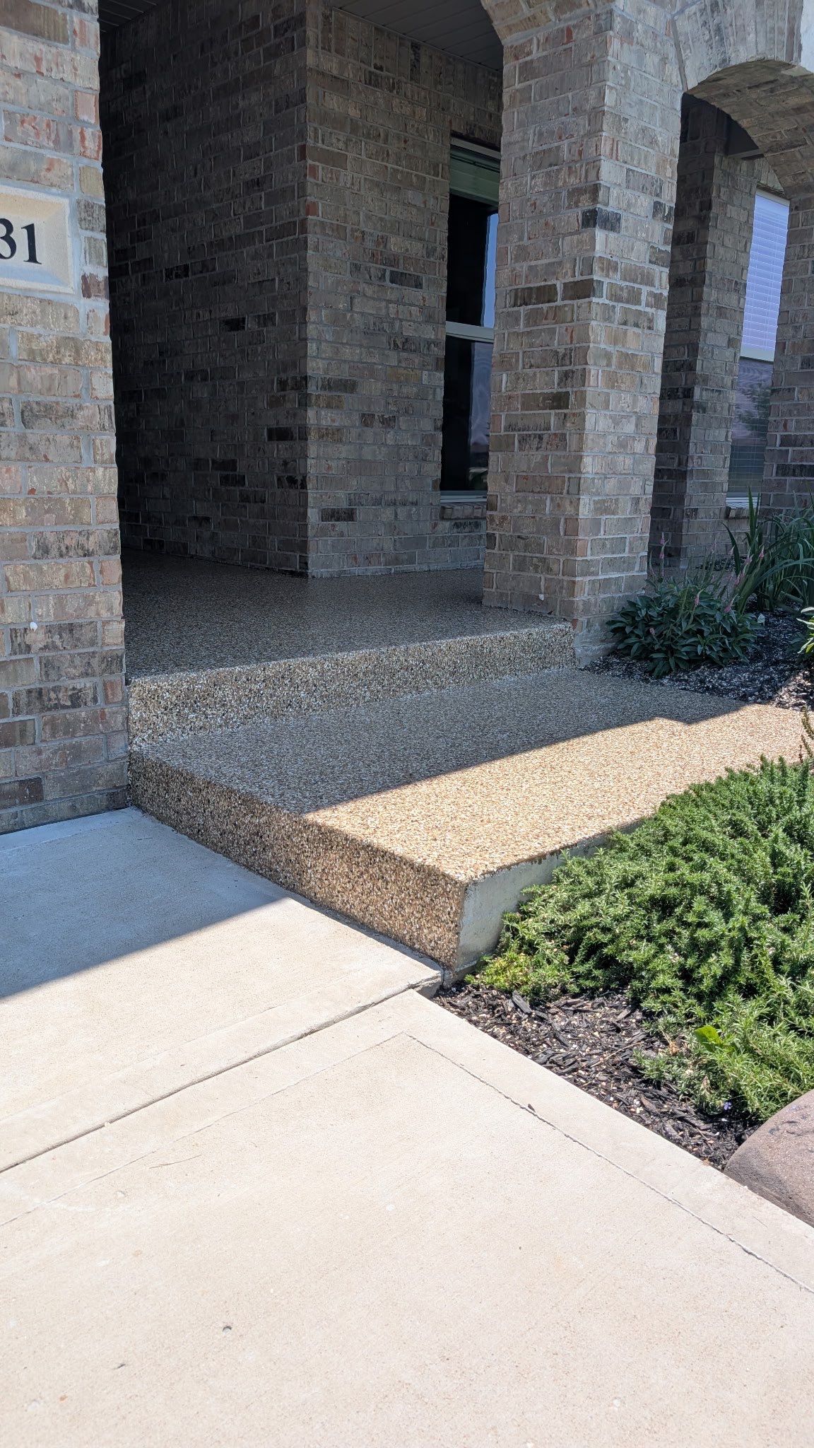 Front Porch Epoxy Coating and Garage Storage System in Shawnee by Banner Garage