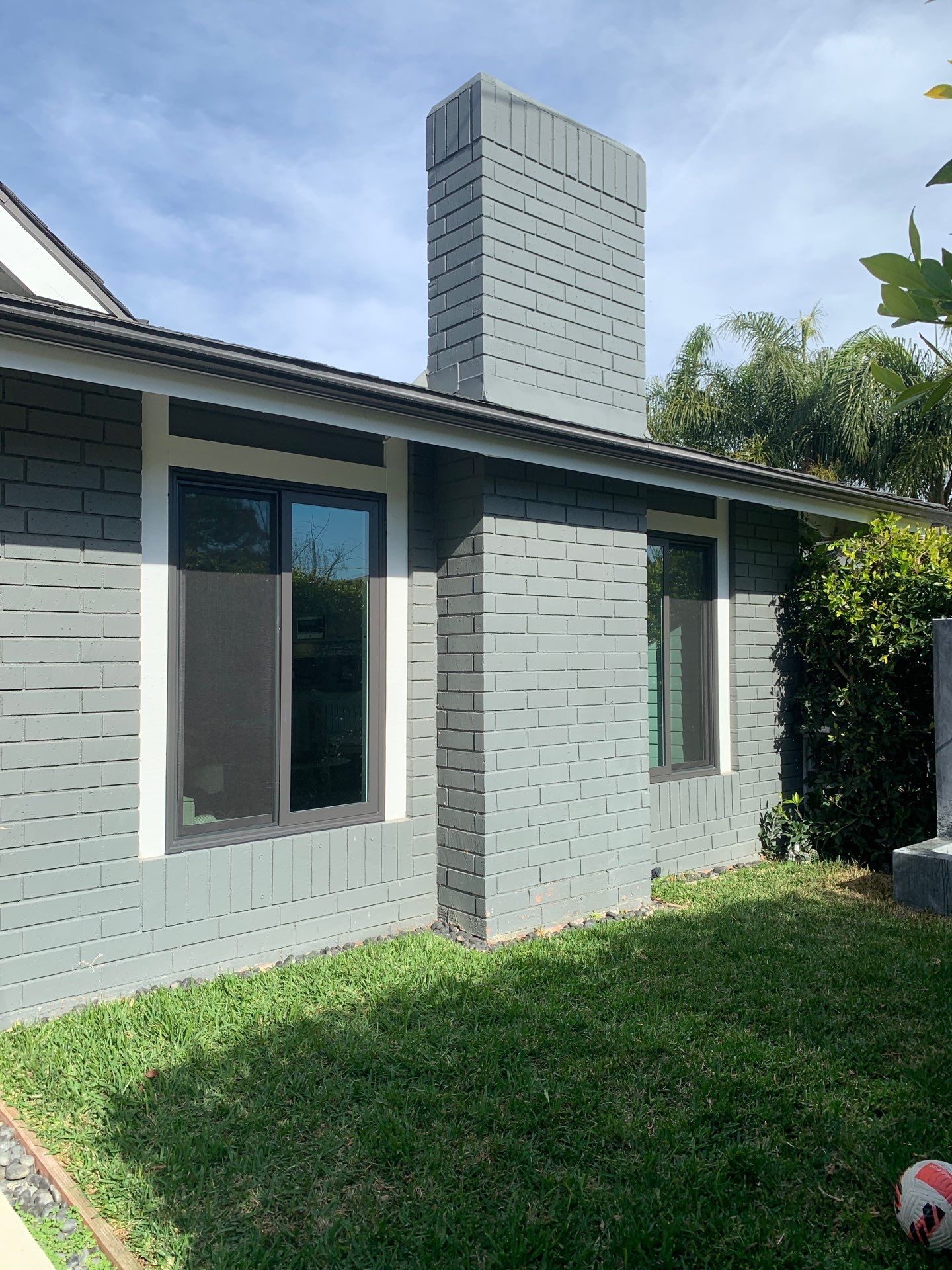 Window Installation using Milgard black vinyl windows by American Window Company