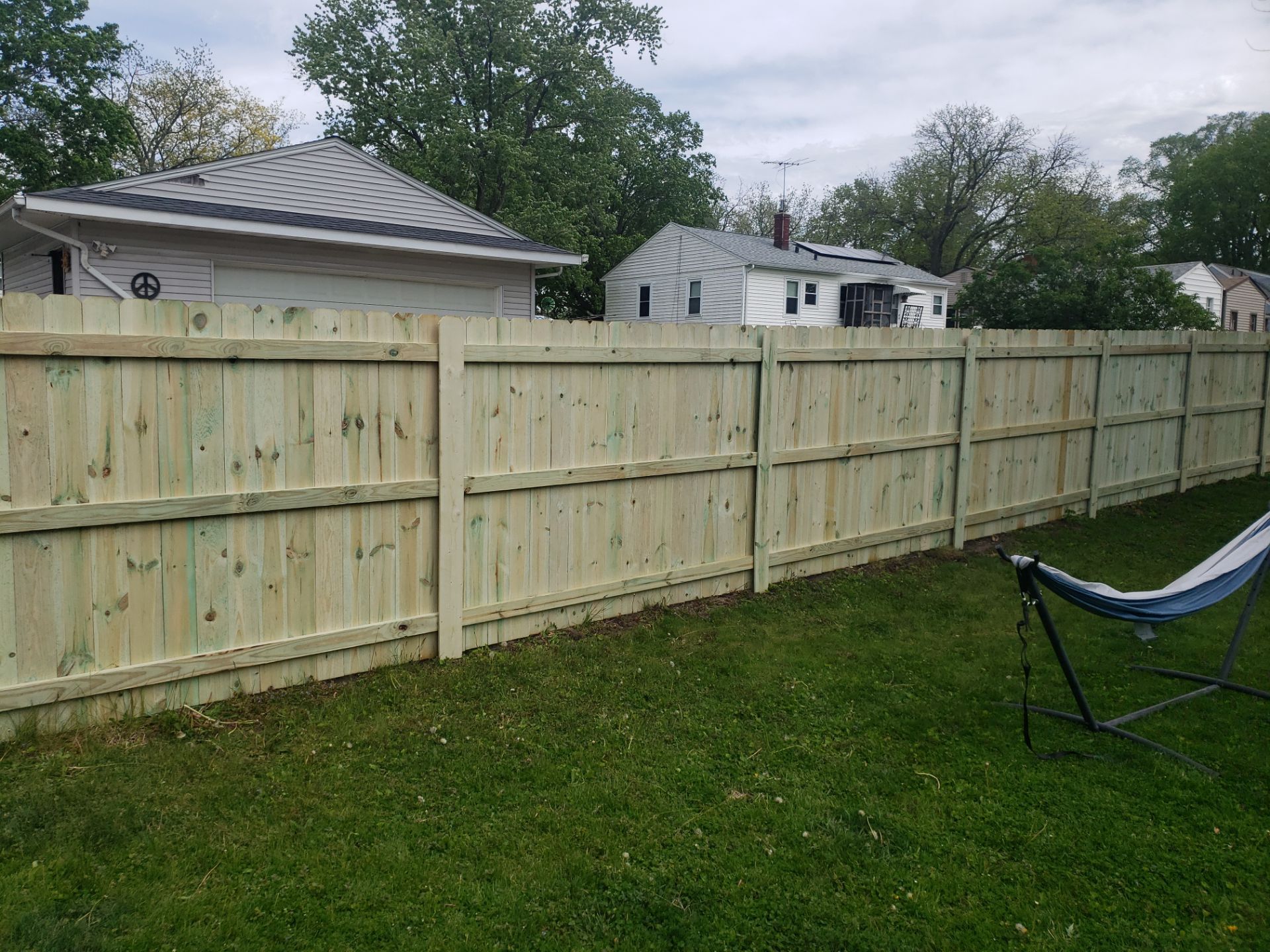 Pressure-Treated Wood Privacy Fence Installation in Waterloo by Perfect Picket Fence and Stain