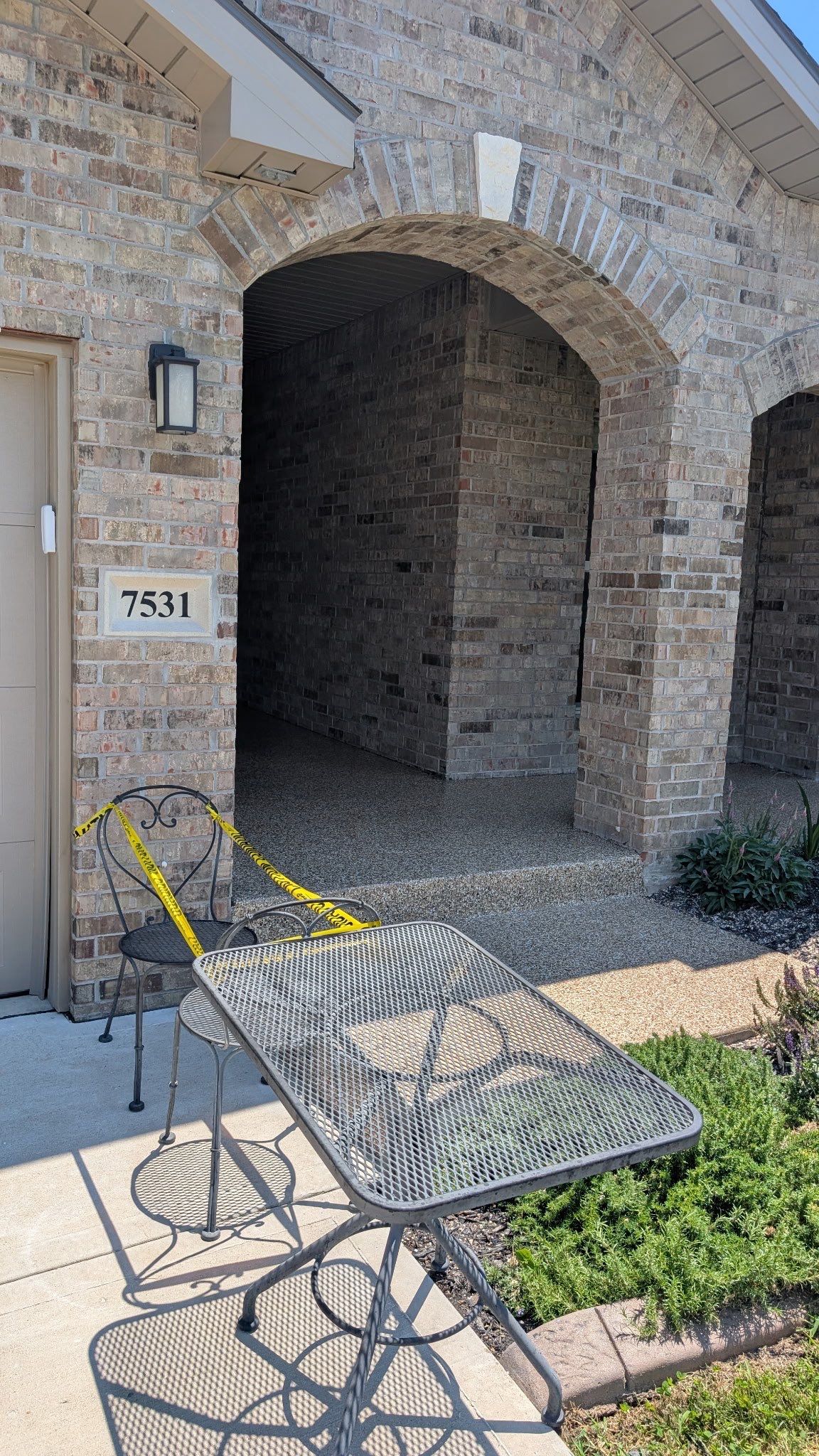 Front Porch Epoxy Coating and Garage Storage System in Shawnee by Banner Garage