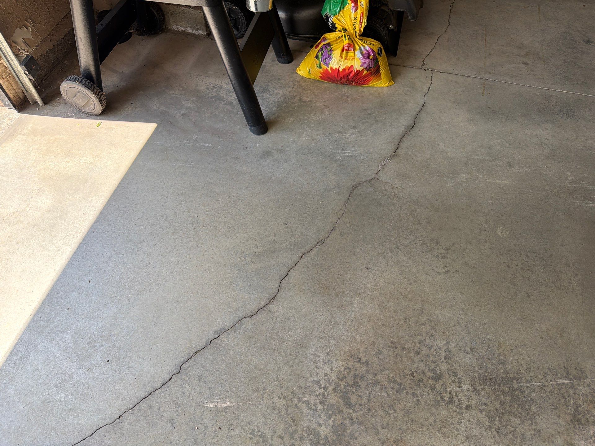 Multi-Car Garage Floor Coating and Crack Repair in Tea by Select Painting, Coatings & Garage Cabinets