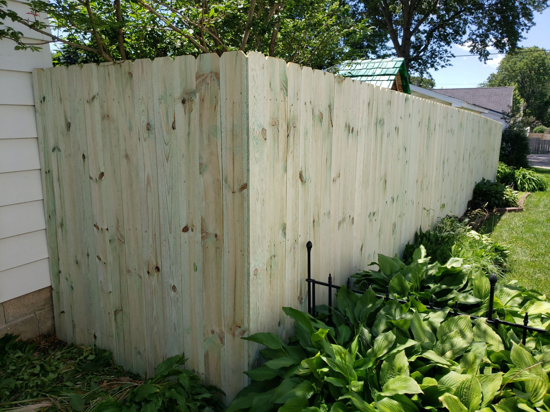 Pressure-Treated Pine Privacy Fence Replacement in Waterloo, Iowa by Perfect Picket Fence and Stain