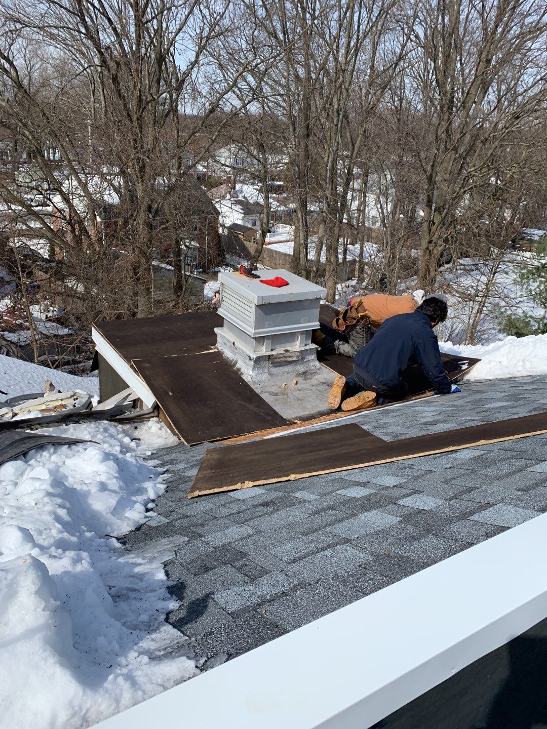 Commercial Roofing Installation using EPDM with white gutters by A Plus Exterior
