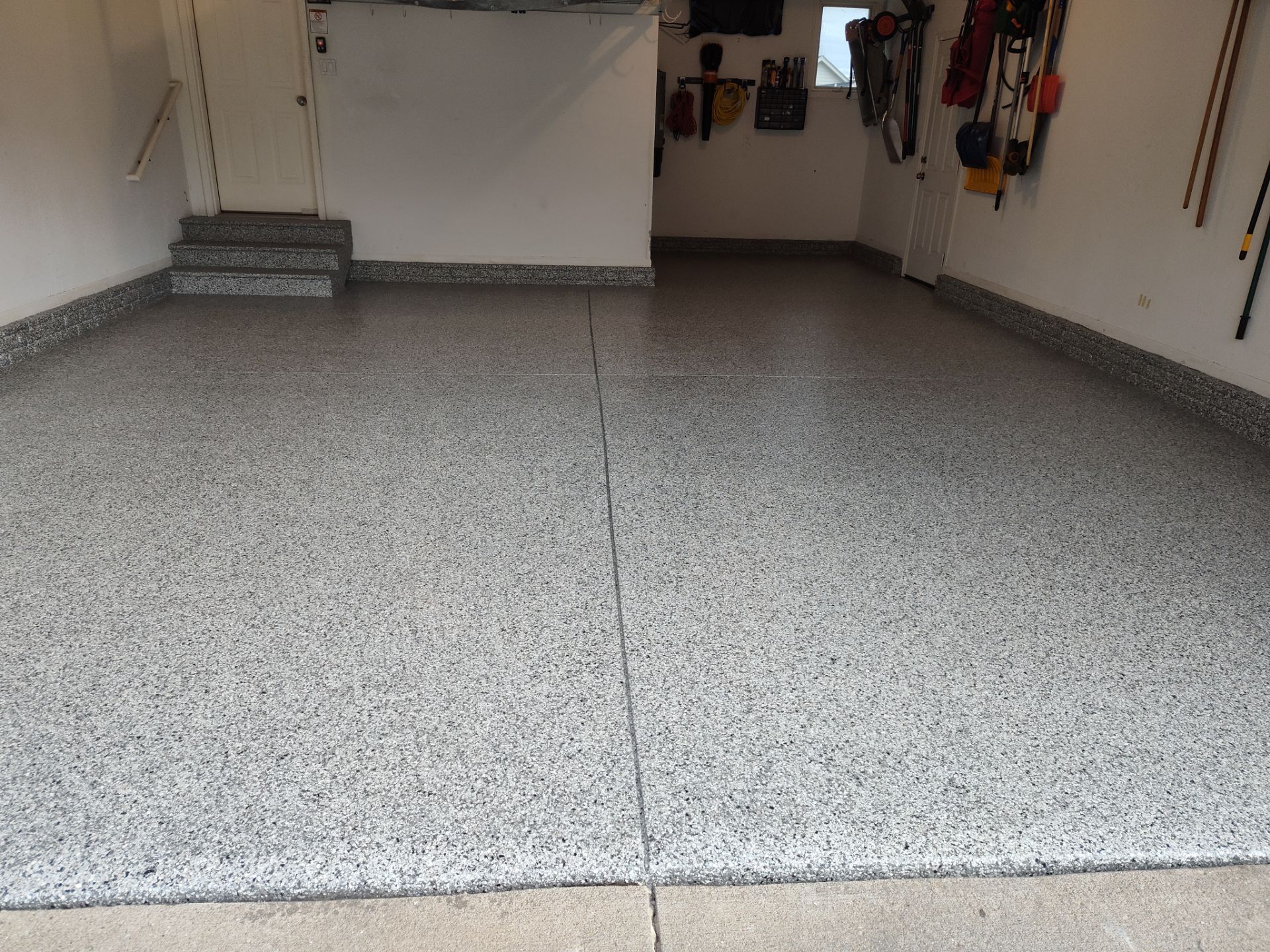 A Garage In One Day Keeps the Rock Salt Away! by Revival Concrete Coatings