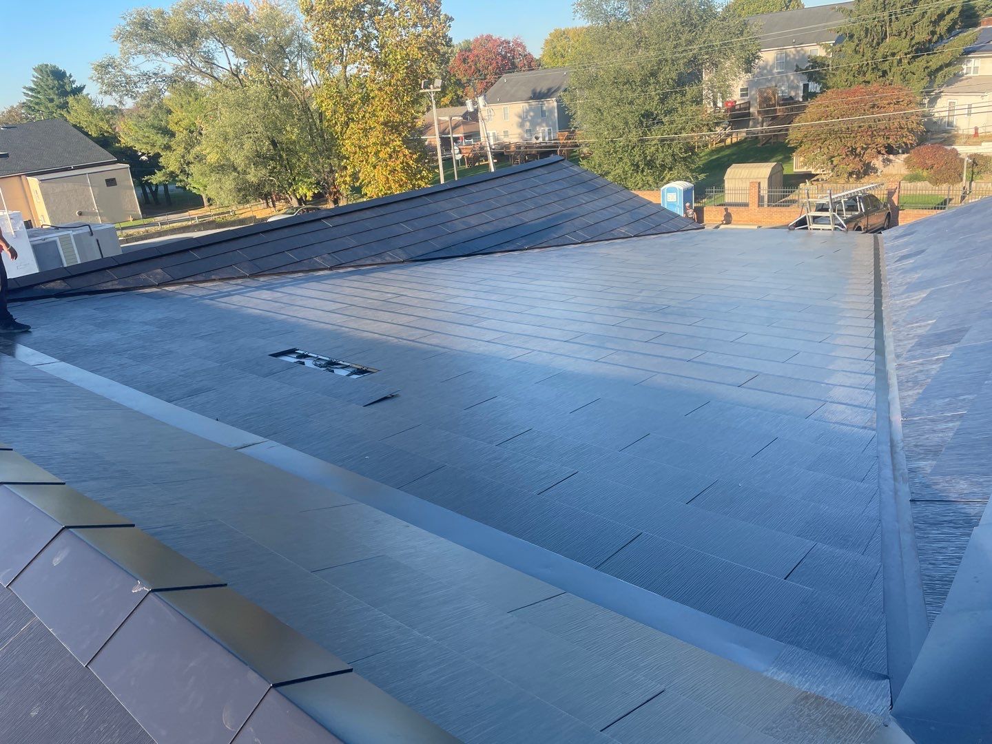 Tesla Solar Roof on a Commercial Building by American Home Contractors
