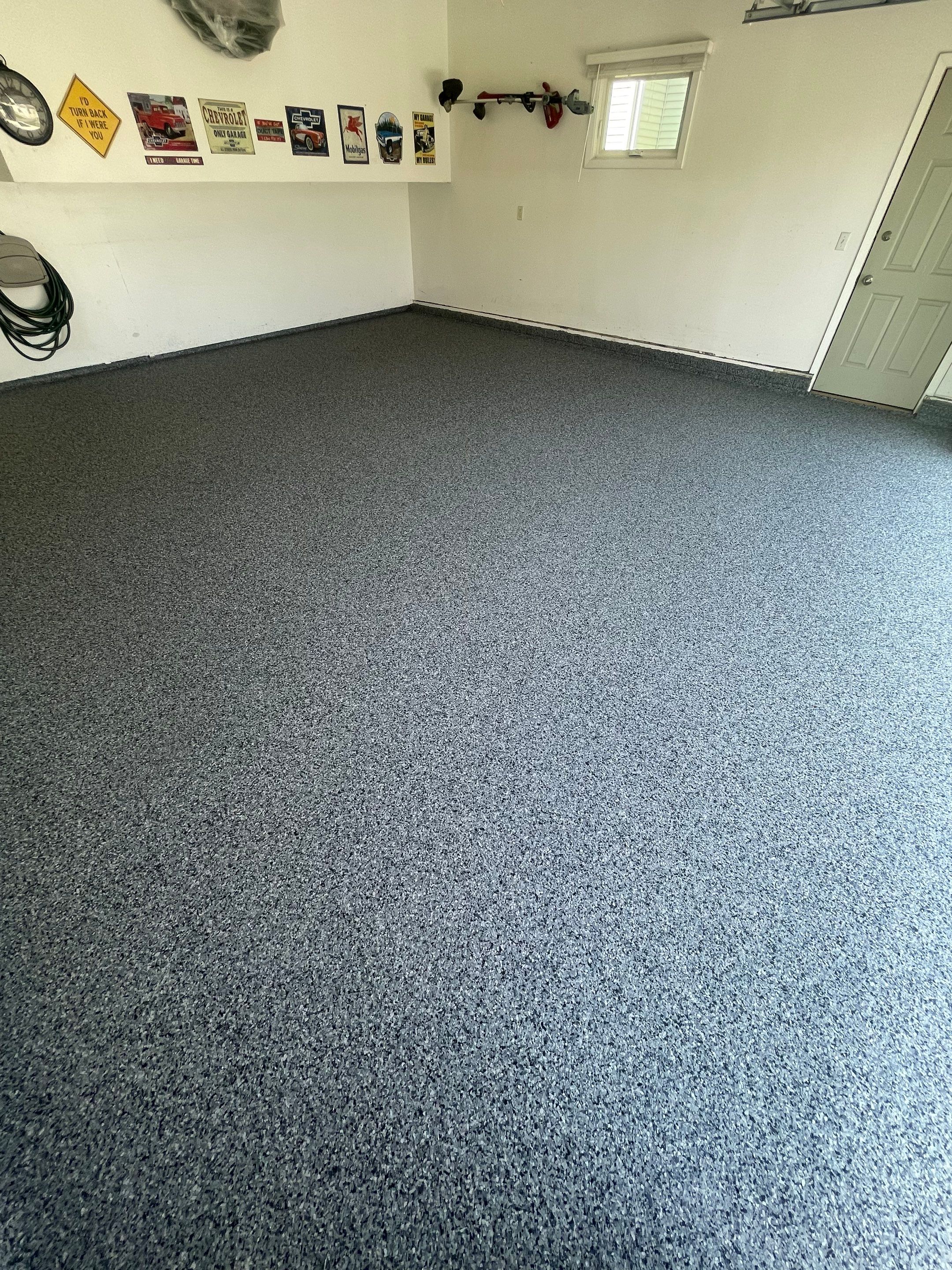 Sioux Falls Garage Floor Coating with Nightfall Decorative Chips by Select Painting, Coatings & Garage Cabinets