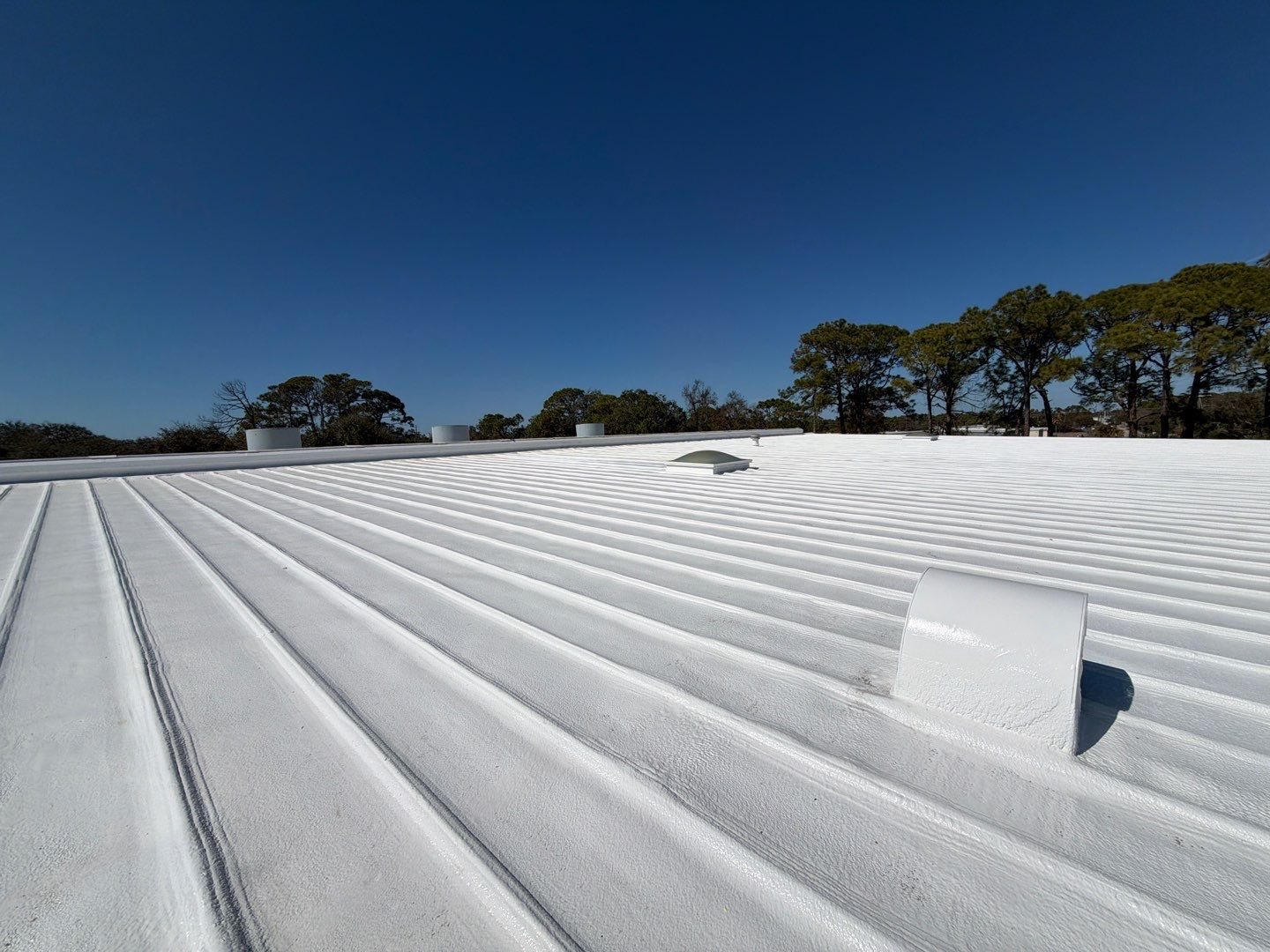 Sarasota Industrial Warehouse Metal Roof Silicone Coating Restoration by CES Roofing