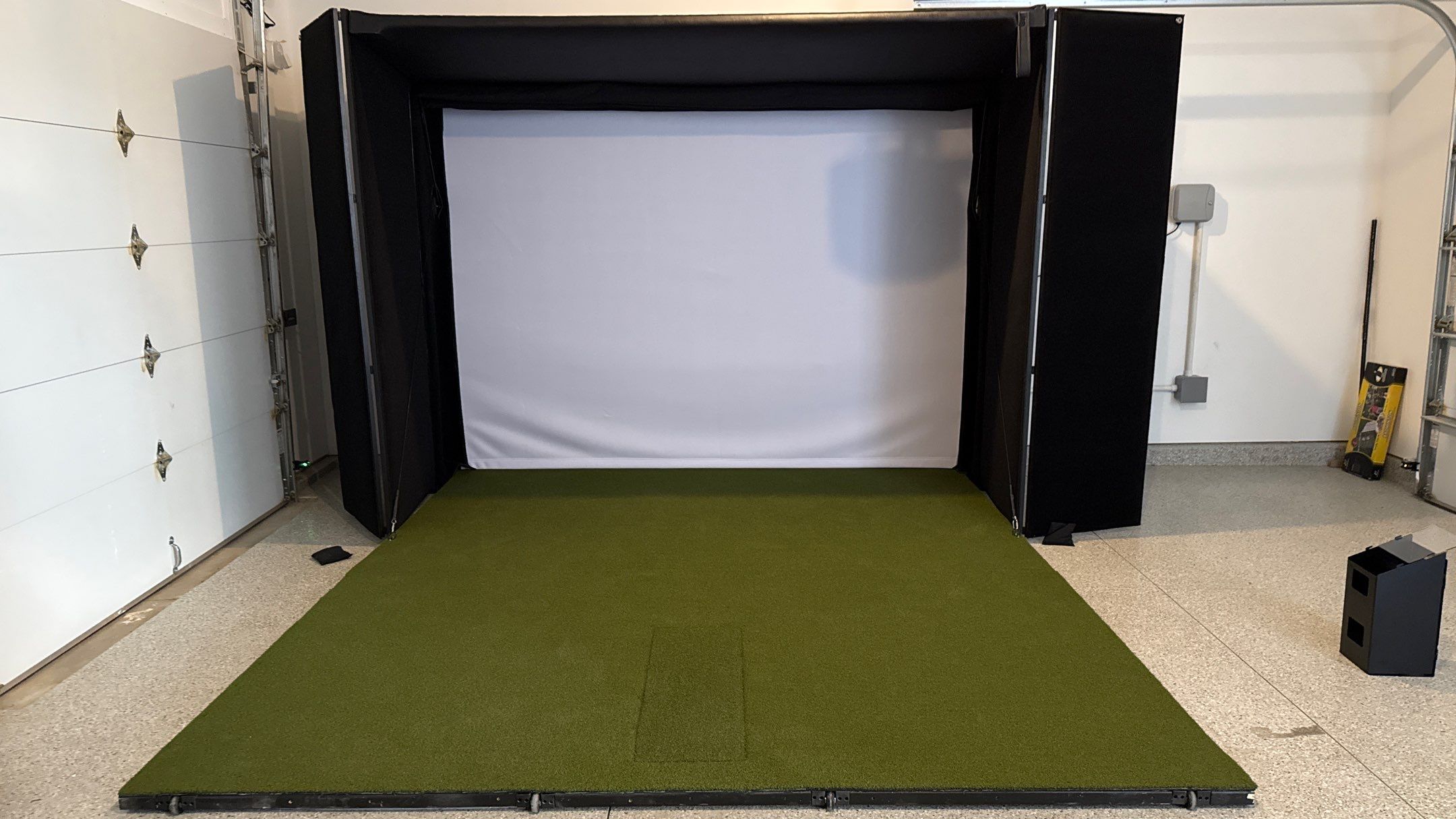Ben Took It To The Next Level With a Golf Simulator by Banner Garage