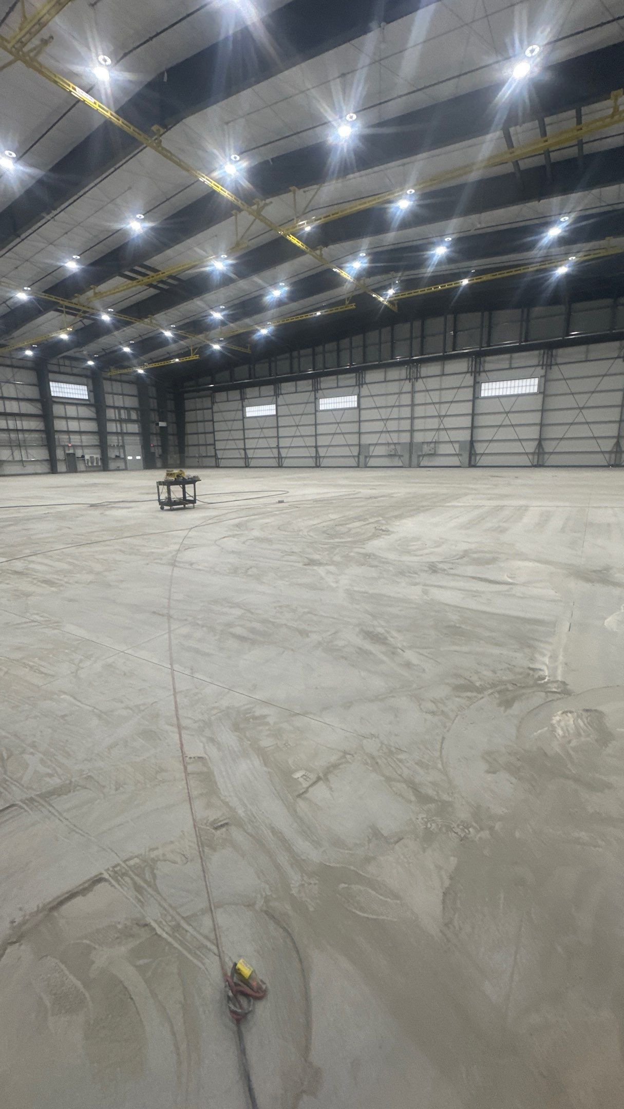 Airplane Hanger using Light Grey Commercial Penntek Epoxy by Croc Coatings, LLC
