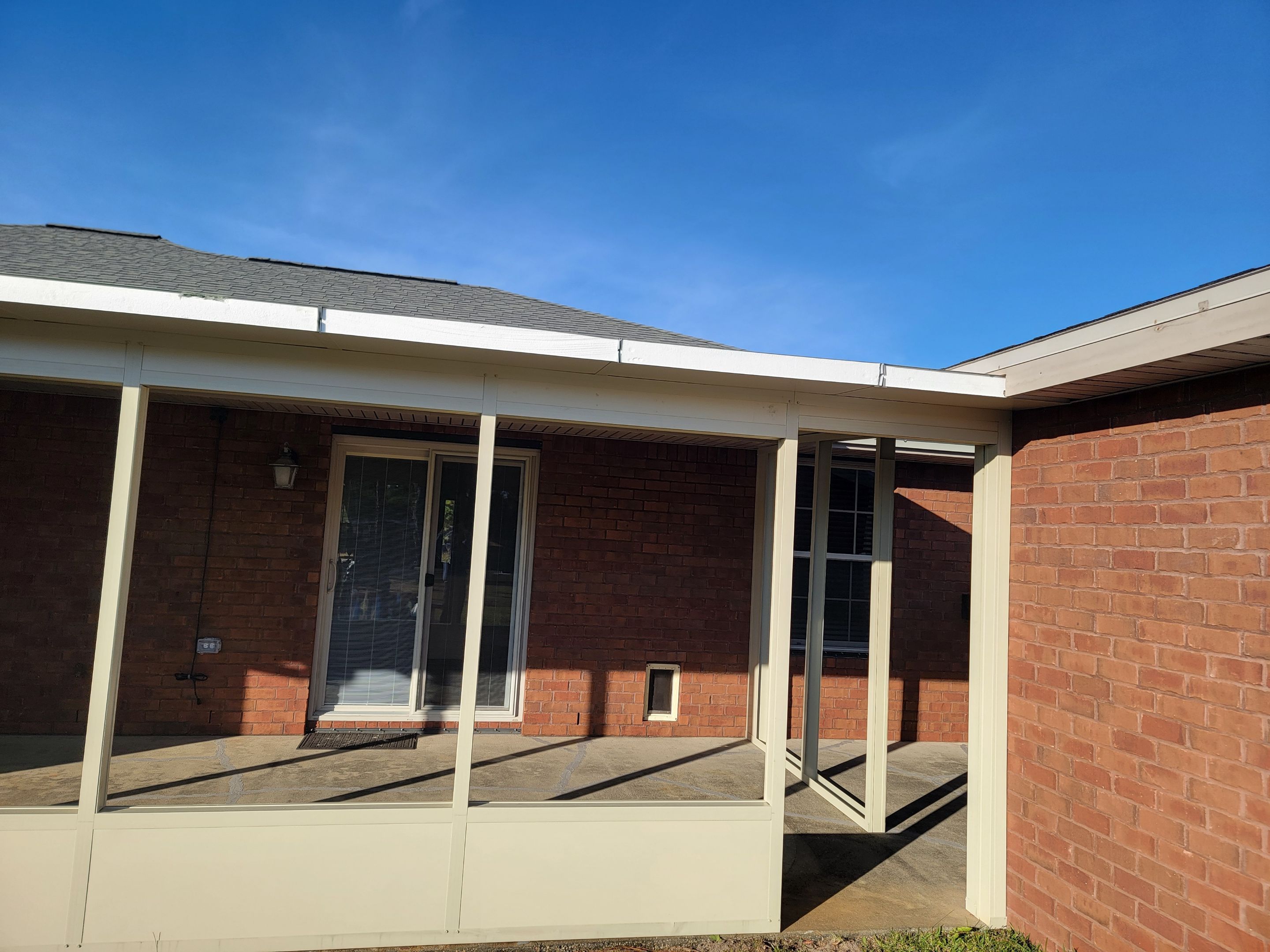 Enclosure w/Vinyl Windows using Colorbeam by Titan Sunrooms