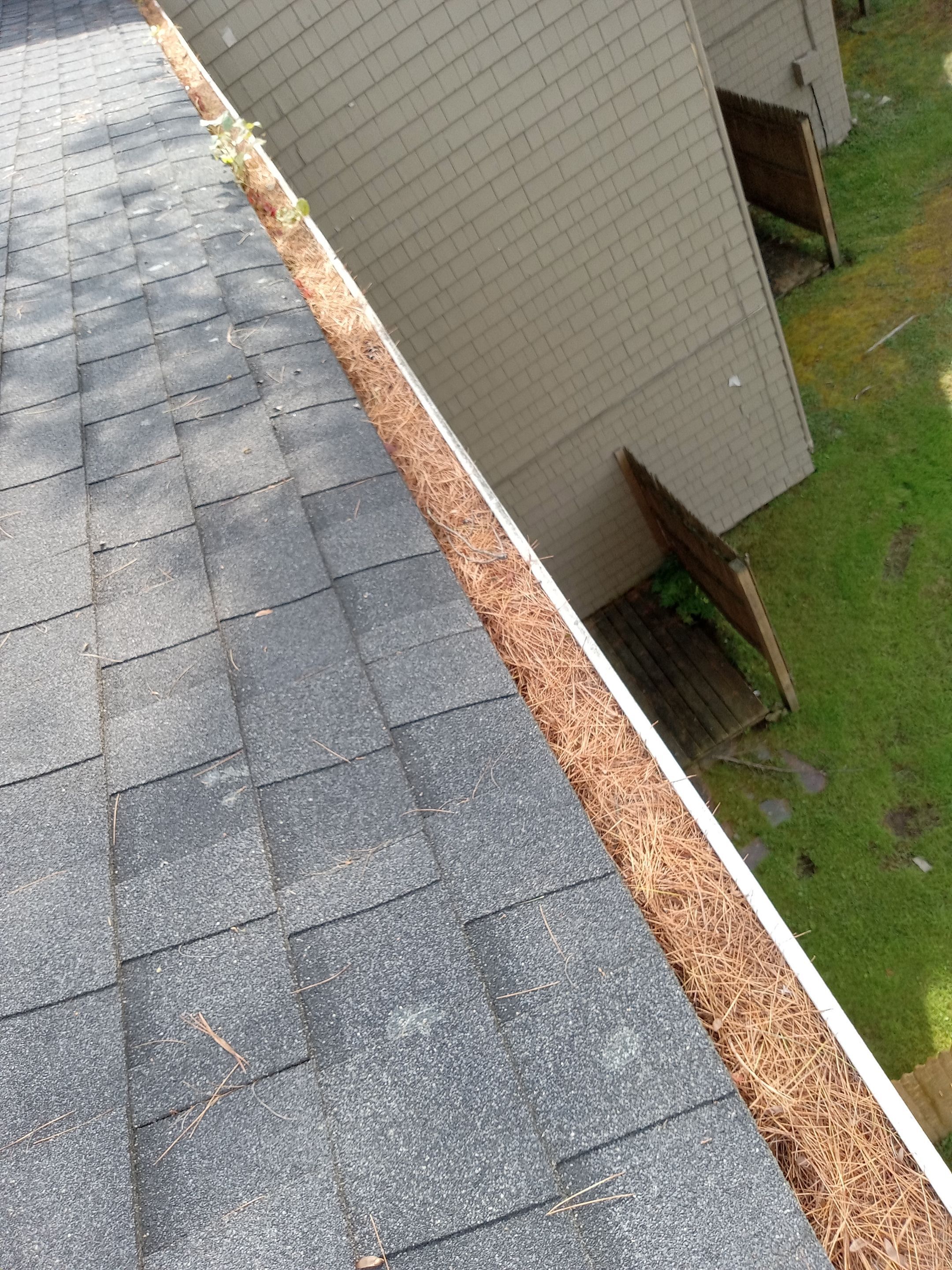 Commercial gutter cleaning Portland, ME before photo with filled gutters