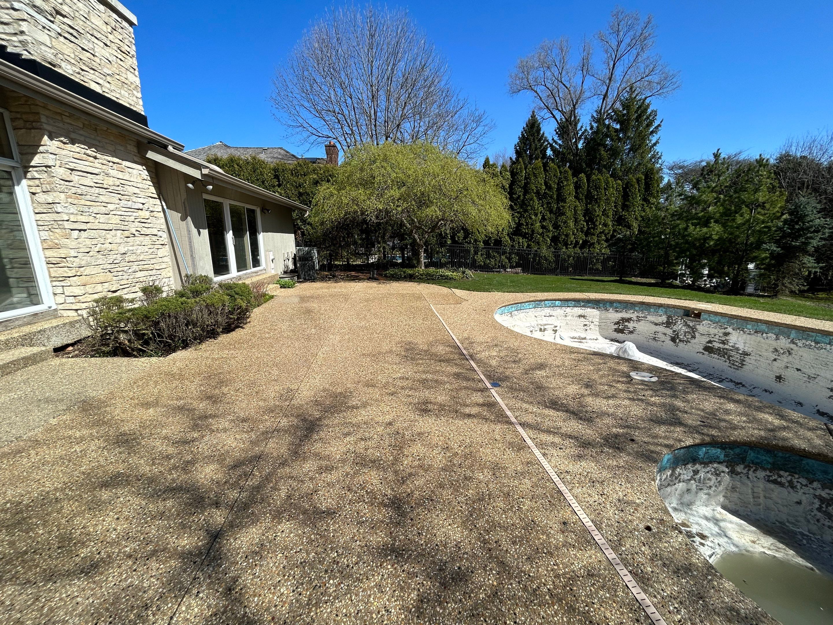 Aggregate Clean and seal using low gloss sealer by Northern Power Washing LLC.