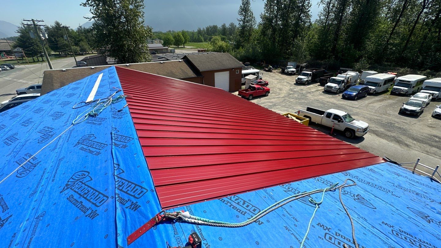 Commercial Roofing Installation using 12" Prolok metal by Top Notch Roofing Inc
