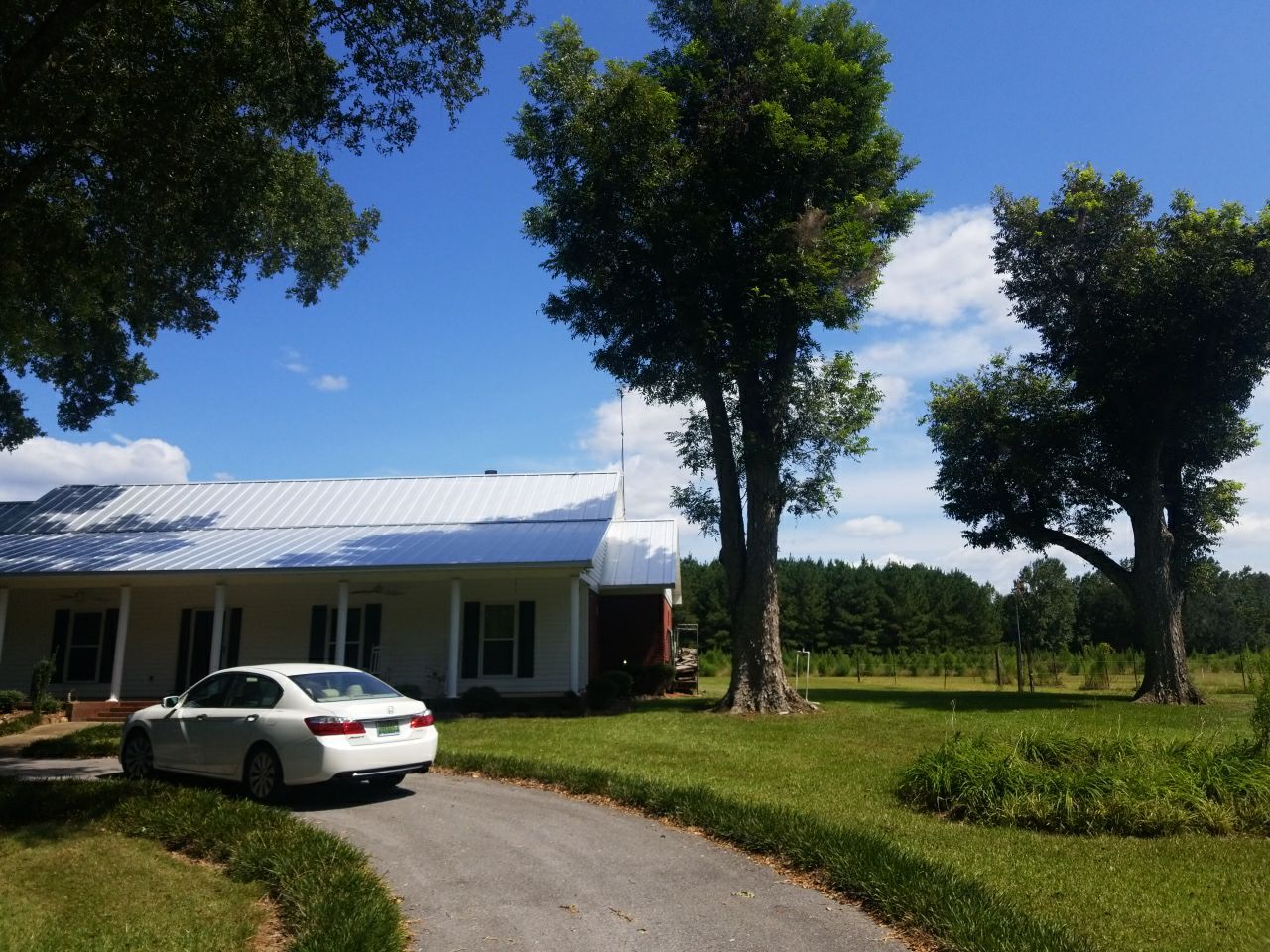 Residential Roofing Installation using Metal roofing by American Roofing & Construction LLC