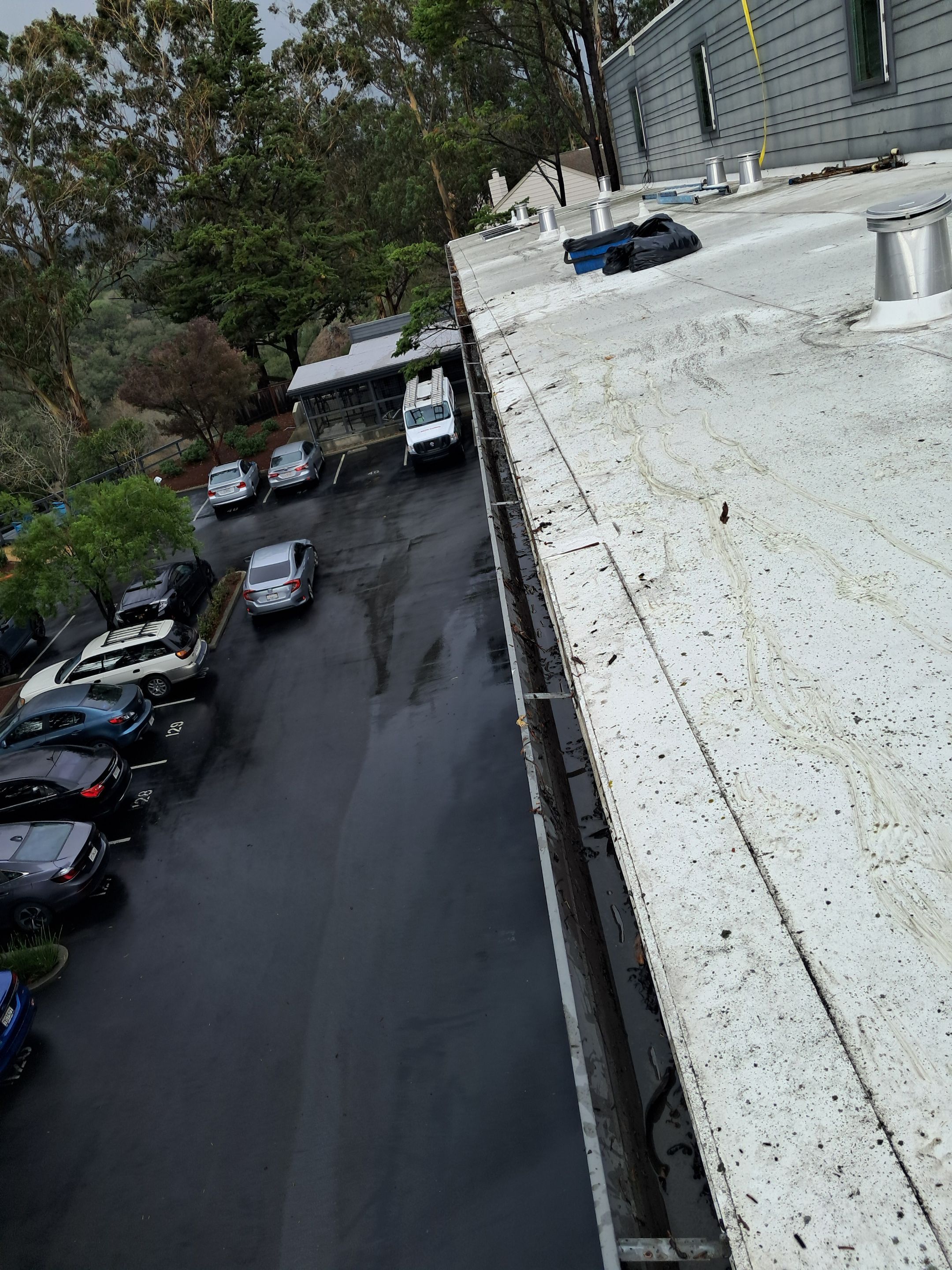 HOA gutter cleaning in Santa Cruz, after  photo showing full gutters.