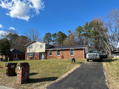 Residential Roofing Installation using Standing Seam Metal