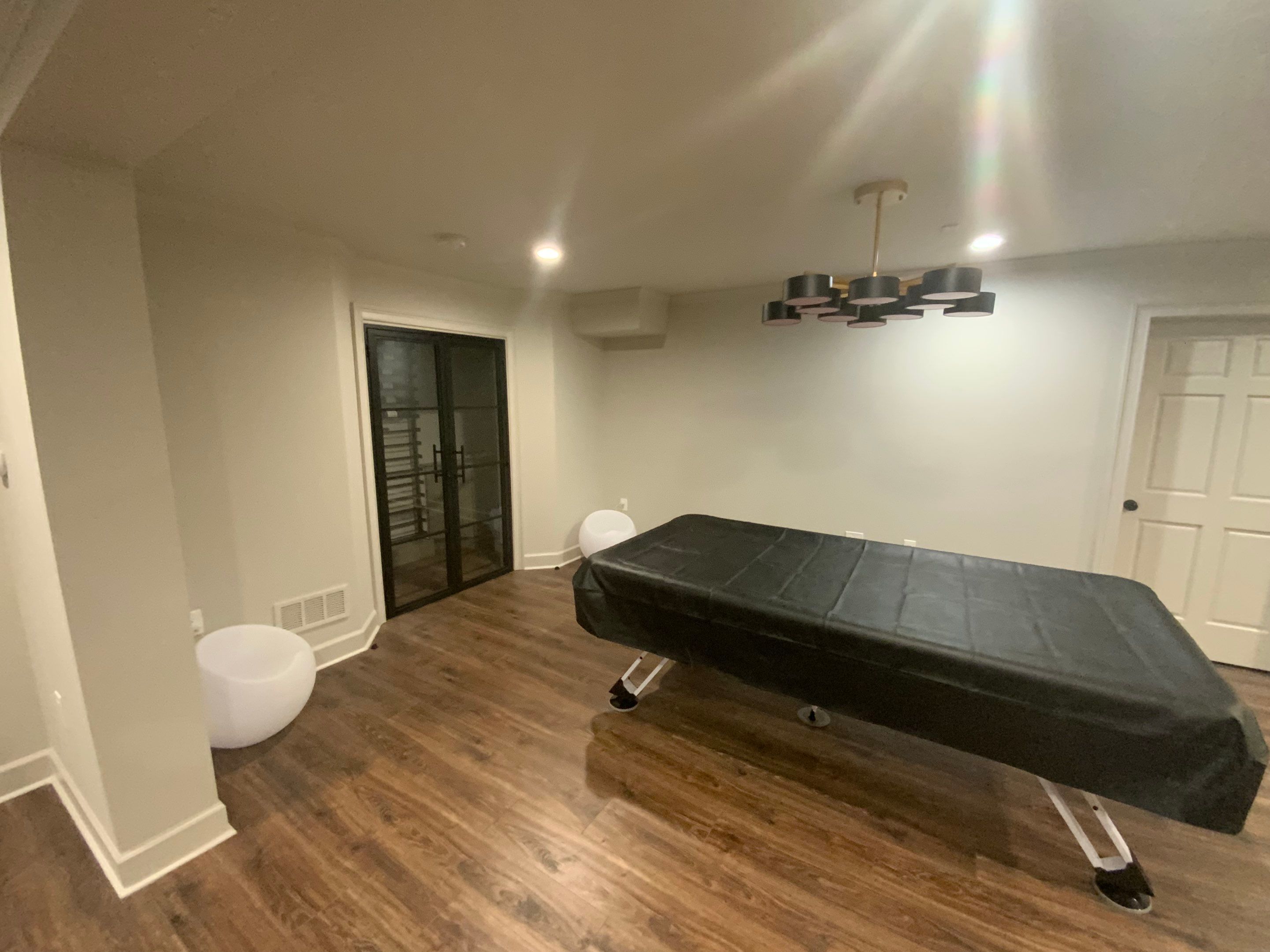 Finished Basement Renovation Featuring Home Theater and Custom Wine Cellar by Swift Home Renovations