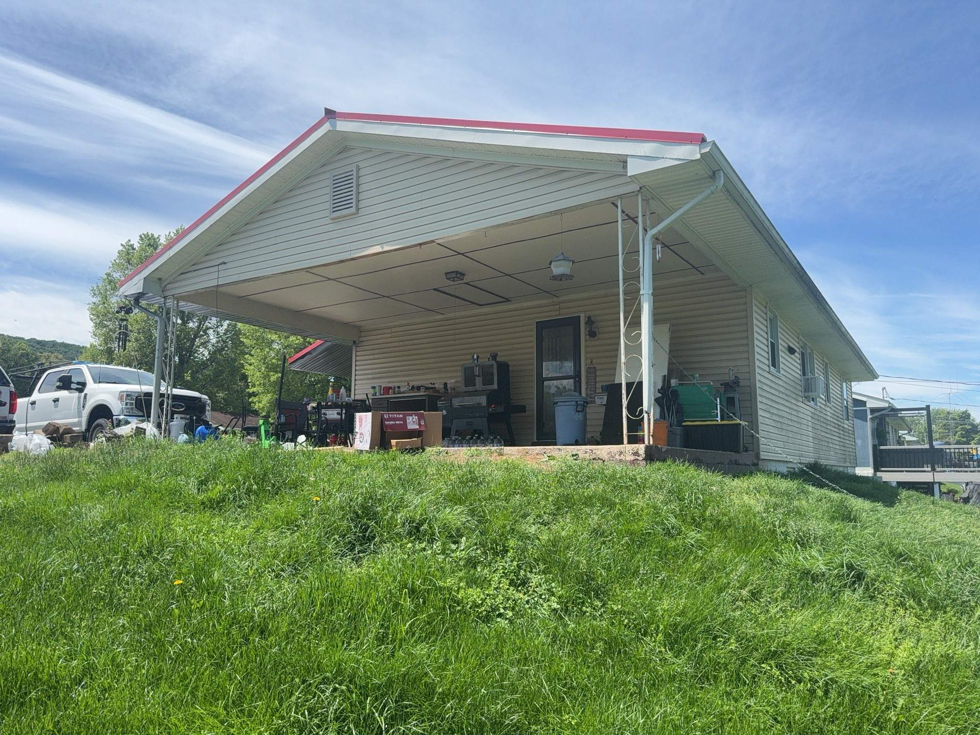Red ABM Panel Metal Roofing Installation on Elizabethville Ranch Home by Esh Builders