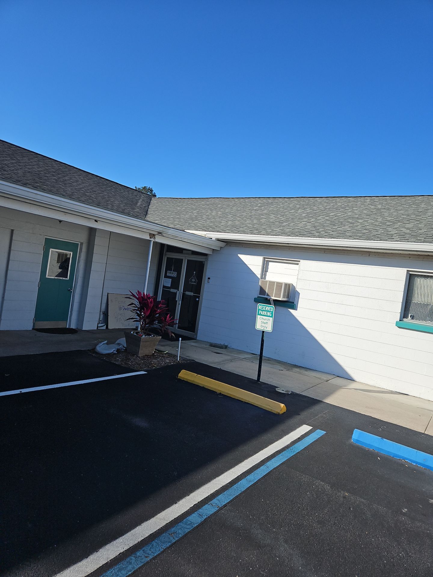 Downspout Installation using White Down Spouts in Sarasota FL by Gutter Professors