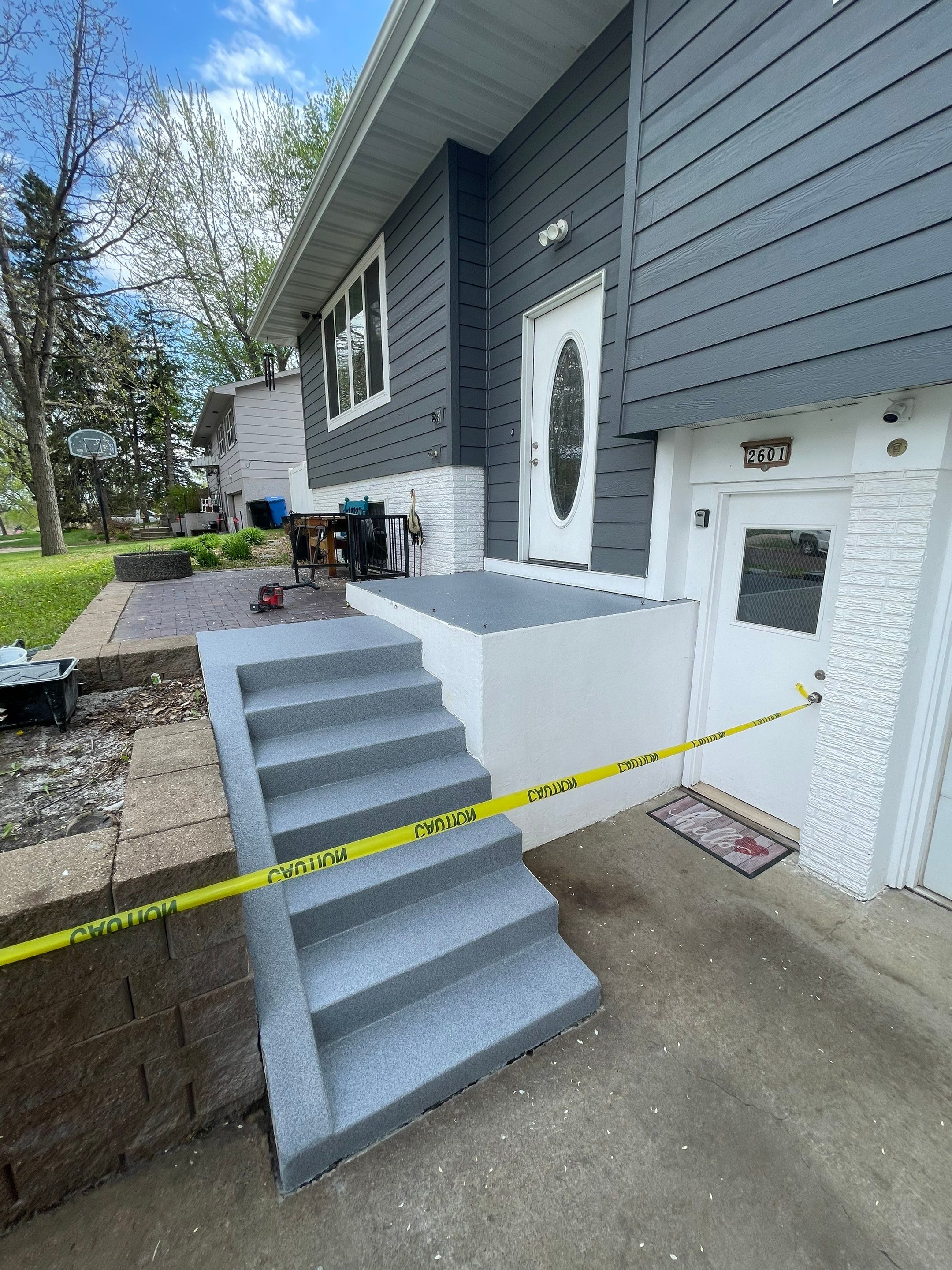 Grey Polyaspartic Porch and Stair Resurfacing in Sioux Falls by Select Painting, Coatings & Garage Cabinets